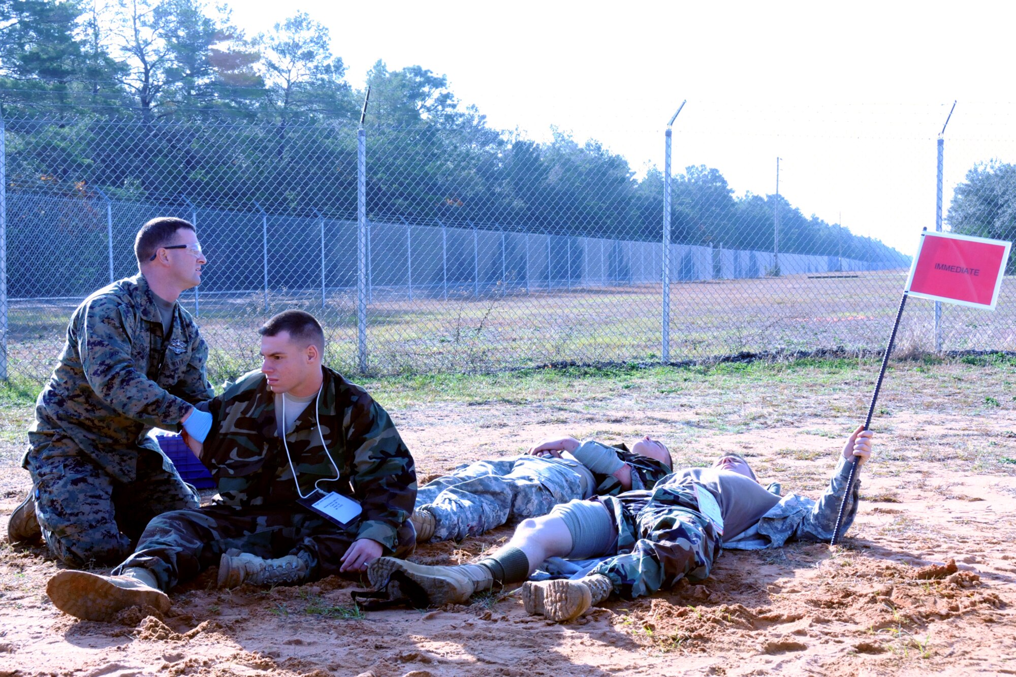 EGLIN AIR FORCE BASE, Fla. – A Marine Corps first responder on the scene of a simulated catastrophe looks for assistance with treating “victims” during a major accident response exercise, Dec. 7, at the Naval Explosive Ordnance Disposal School. The event simulated an accident where a truck carrying C-4 explosives careens into a bus filled with Soldiers. The NAVEOD School performs MAREs annually to examine how effective they can respond in the event of a catastrophe while communicating and working with outside emergency agencies. (U.S. Air Force photo/ Airman 1st Class Anthony Jennings)