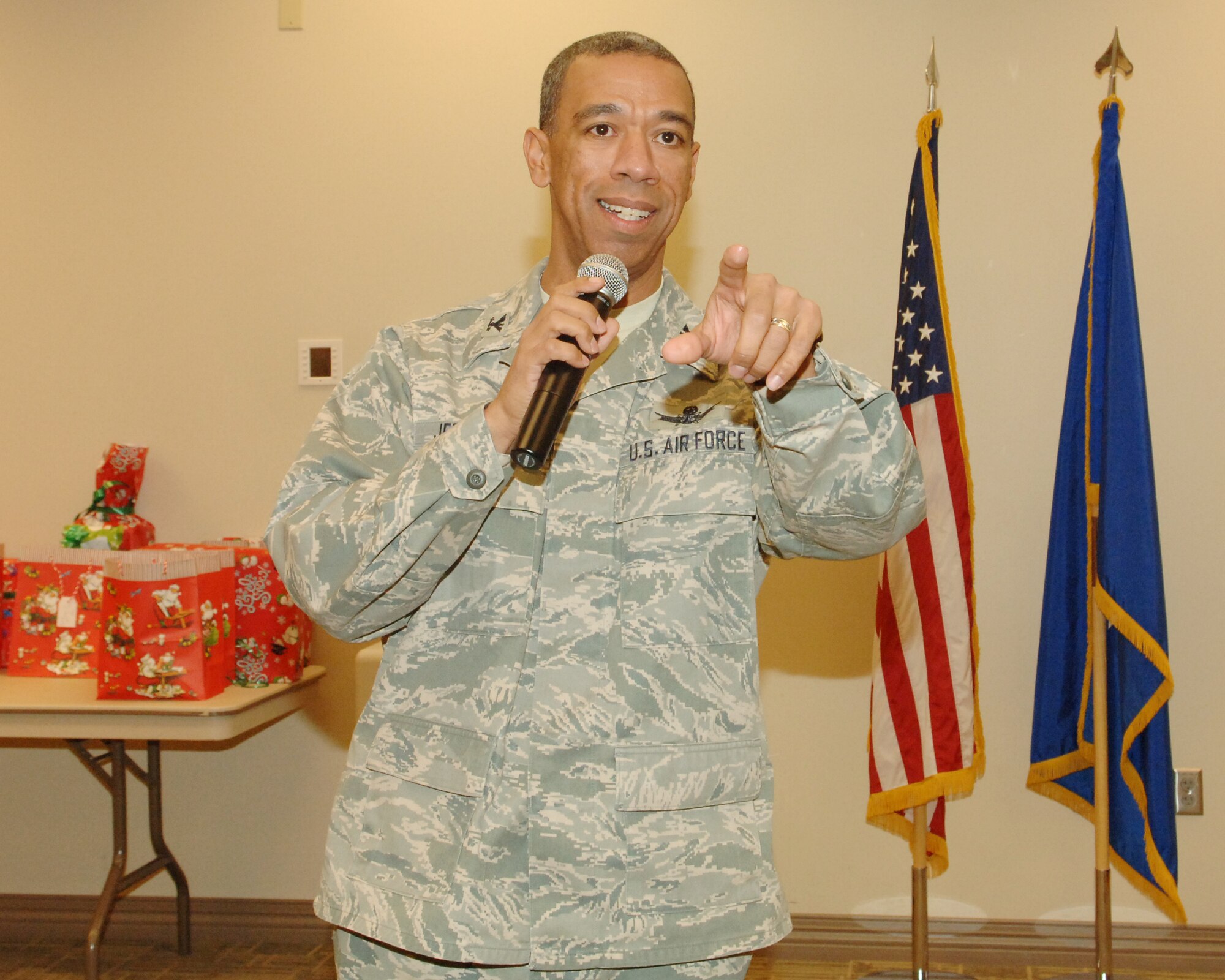 BUCKLEY AIR FORCE BASE, Colo. -- Col. Vincent Jefferson, 460th Mission Support Group commander, talks to deployed spouses at the Chapel Annex during a dinner in their honor on Dec. 4. (U. S. Air Force photo by Tech. Sgt. Shirley Henderson)