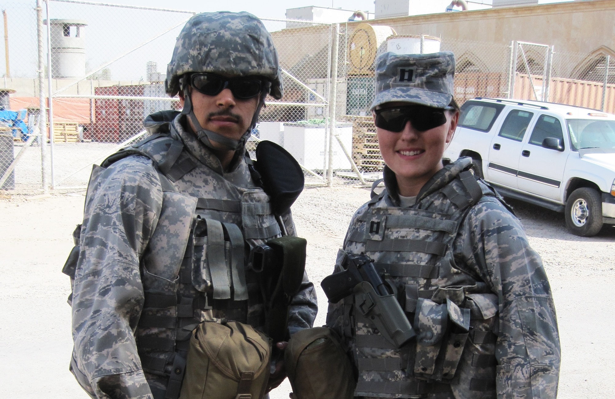 Capt. Maureen Wood, right, stands with fellow legal officer Capt. Jaime Espinosa prior to a mission in Iraq. Captains Wood and Espinosa are assigned to Joint Task Force 134.                               