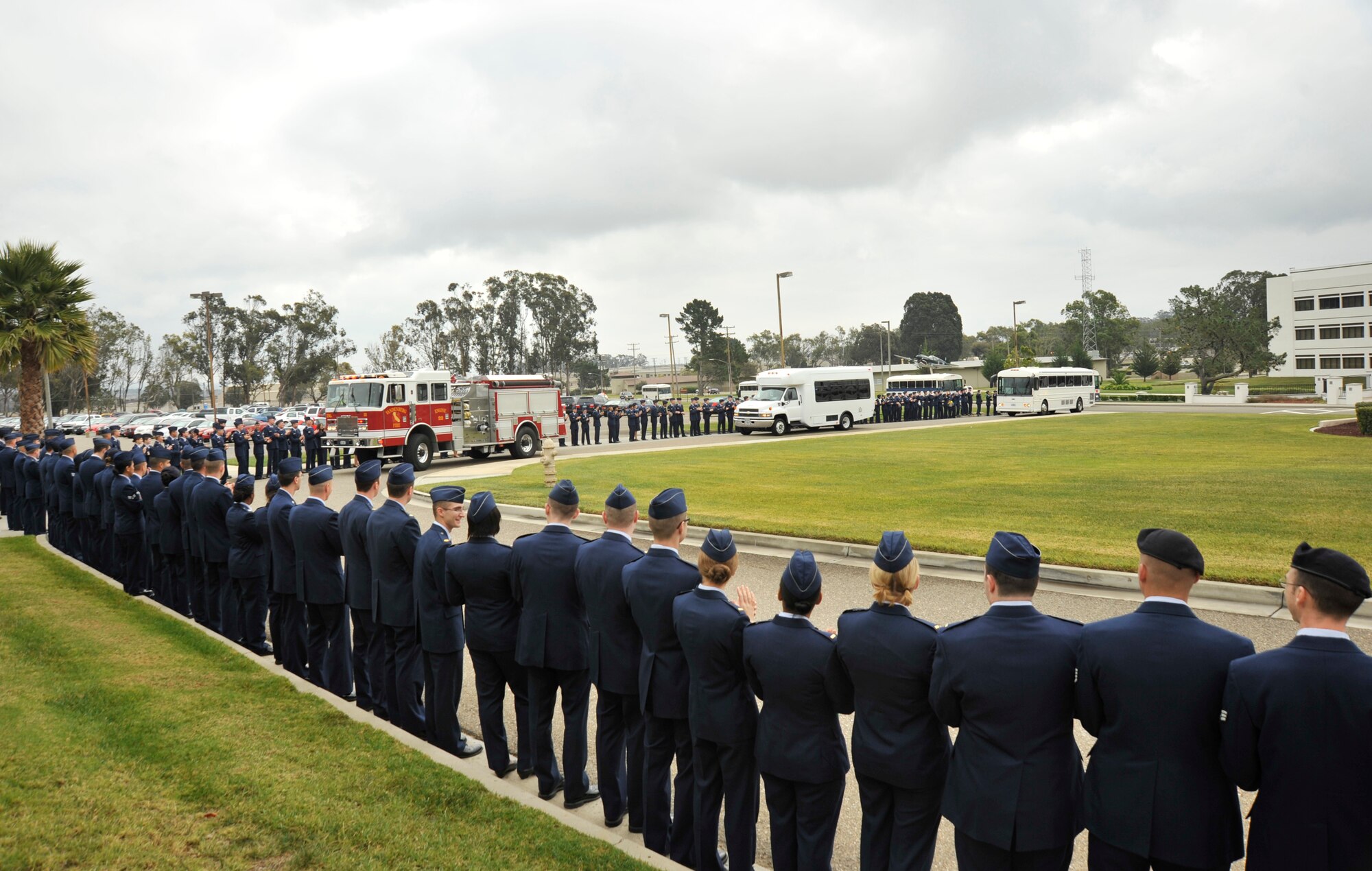 VANDENBERG AIR FORCE BASE, Calif. -- Airman from Team Vandenberg line up outside of the Pacific Coast Club here to welcome children to Vandenberg's Operation Kids Christmas on Saturday, Dec. 5, 2009. Approximately 200 children from the local community were escorted onto the base by security forces personnel and firefighters. (U.S. Air Force photo/Senior Airman Stephanie Longoria)


