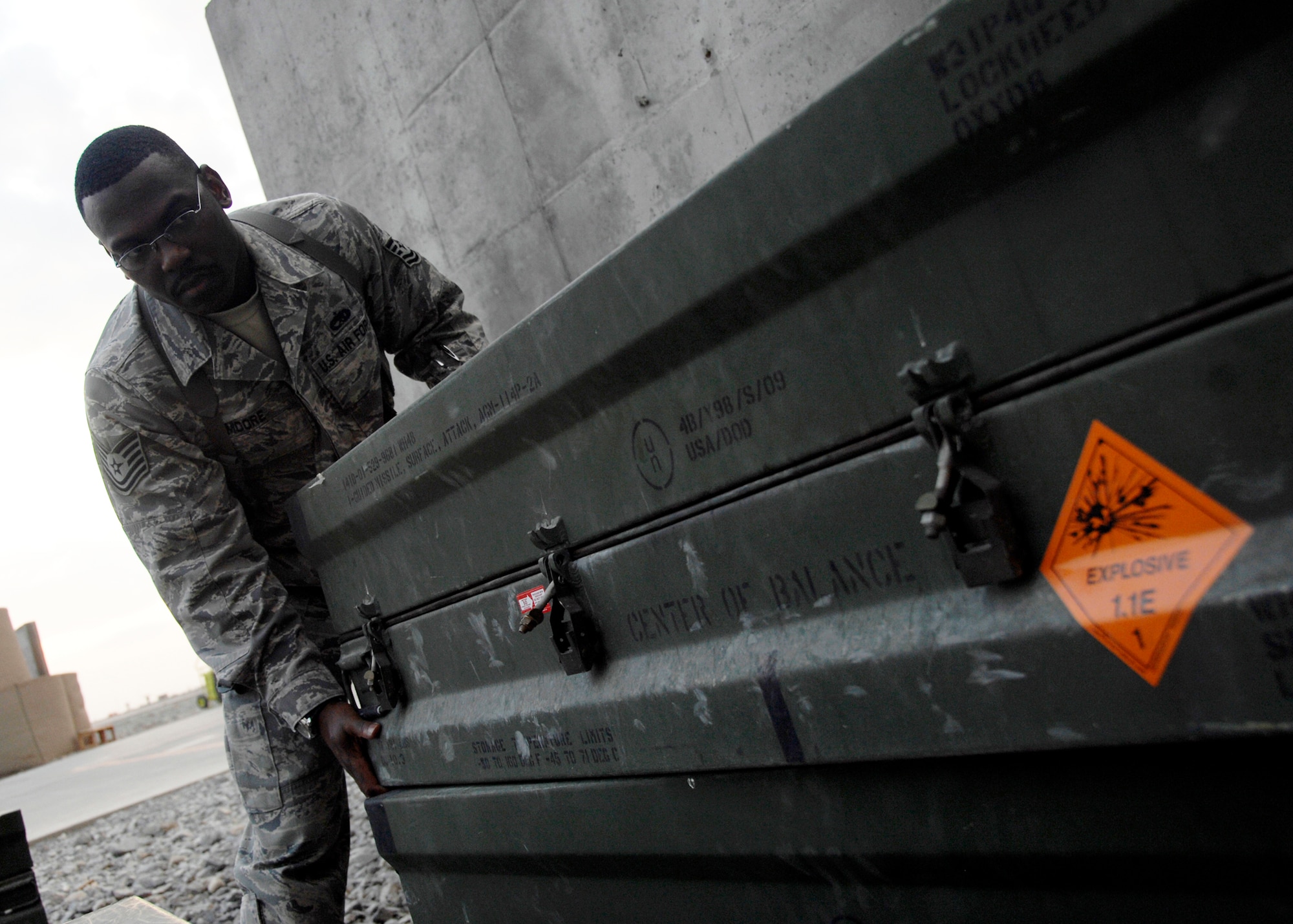 Tech. Sgt. Anthony Moore monitors net explosive weights during a spot inspection on the flightline Dec. 3, 2009, at Kandahar Airfield, Afghanistan. Sergeant Moore is a weapons safety manager for the 451st Safety Office from Langley Air Force Base, Va. (U.S. Air Force photo/Senior Airman Timothy Taylor)
