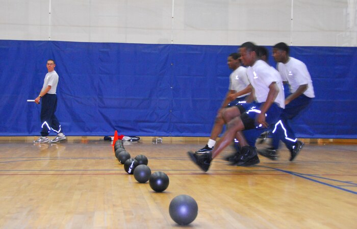 Airmen from the 437th Force Support Squadron race to the center line during the during the Commander's Fitness Challenge dodgeball tournament at the Fitness and Sports Center here Dec. 4. The dodgeball challenge was hosted by the 437th Maintenance Group and drew more than 200 participants. (U.S. Air Force photo/Airman 1st Class Lauren Laidlaw)