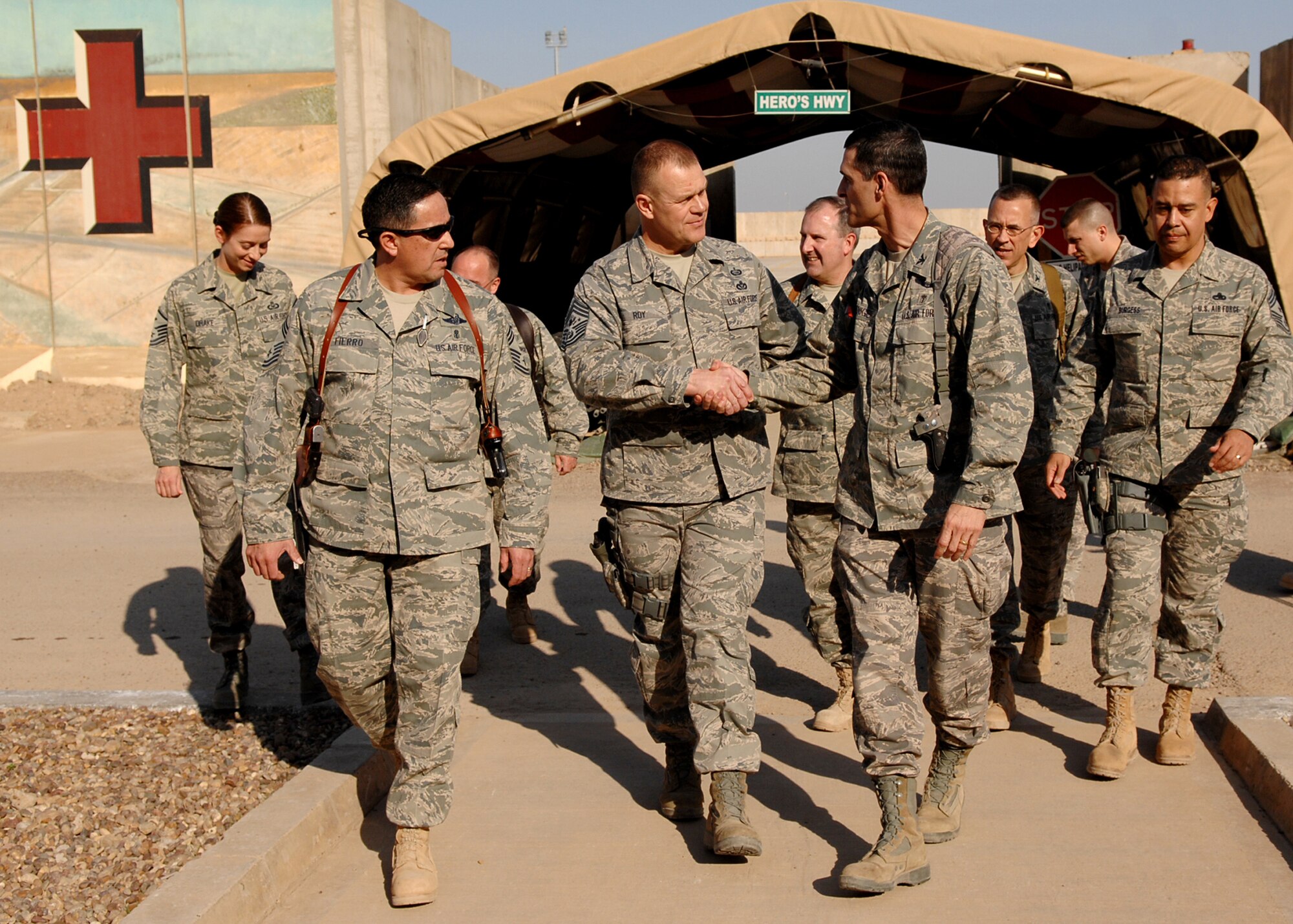 JOINT BASE BALAD, Iraq -- Chief Master Sgt. of the Air Force James Roy shakes hands with Col. Mark Koeniger, commander of the 332nd Expeditionary Medical Support Group, after touring Hero's Highway at the Air Force Theater Hospital Dec. 4, 2009. During his first visit to Joint Base Balad as the chief master sergeant of the Air Force, Chief Roy toured various locations on the base and mentored Airmen during an Airman's call. (U.S. Air Force photo/Senior Airman Christopher Hubenthal)