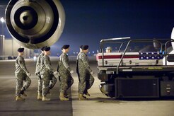 A U.S. Army carry team transfers the remains of Army Spc. Elijah J. Rao of Lake Oswego, Ore., at Dover Air Force Base, Del., Dec 7, 2009. Rao was assigned to the 2nd Battalion, 77th Field Artillery Regiment, 4th Brigade Combat Team, 4th Infantry Division, Fort Carson, Colo. He died Dec. 5 in Alin Gar district, Afghanistan, of wounds sustained when enemy forces attacked his unit with an improvised explosive device. (U.S. Air Force photo/Jason Minto)