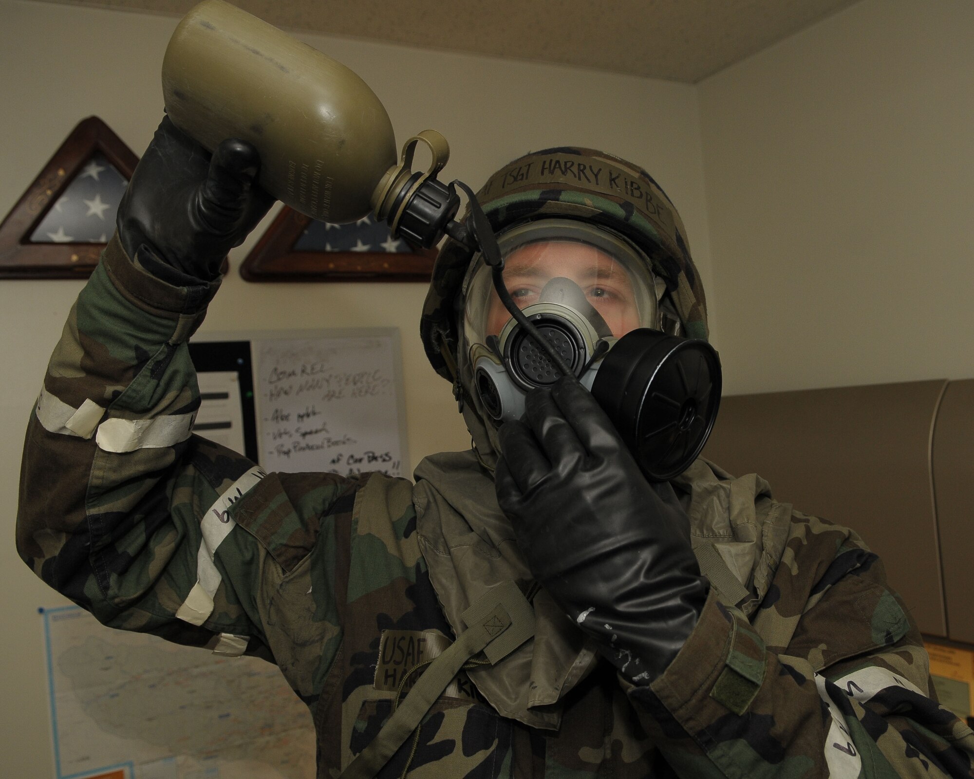 YOKOTA AIR BASE, Japan -- Tech. Sgt. Harry Kibbe, 374th Airlift Wing, drinks from his canteen Dec. 8 during an operational readiness inspection conducted by the Pacific Air Forces Inspector General. Maintaining proper hydration and rest discipline helps offset the adverse effects of thermal build-up, dehydration and associated stress factors. Airmen should only use water in their canteens unless otherwise directed. Liquids other than water may leave residue in the drinking tube and some sugars can blcok the tube and decay, causing illness. (U.S. Air Force photo/Airman 1st Class Sean Martin)