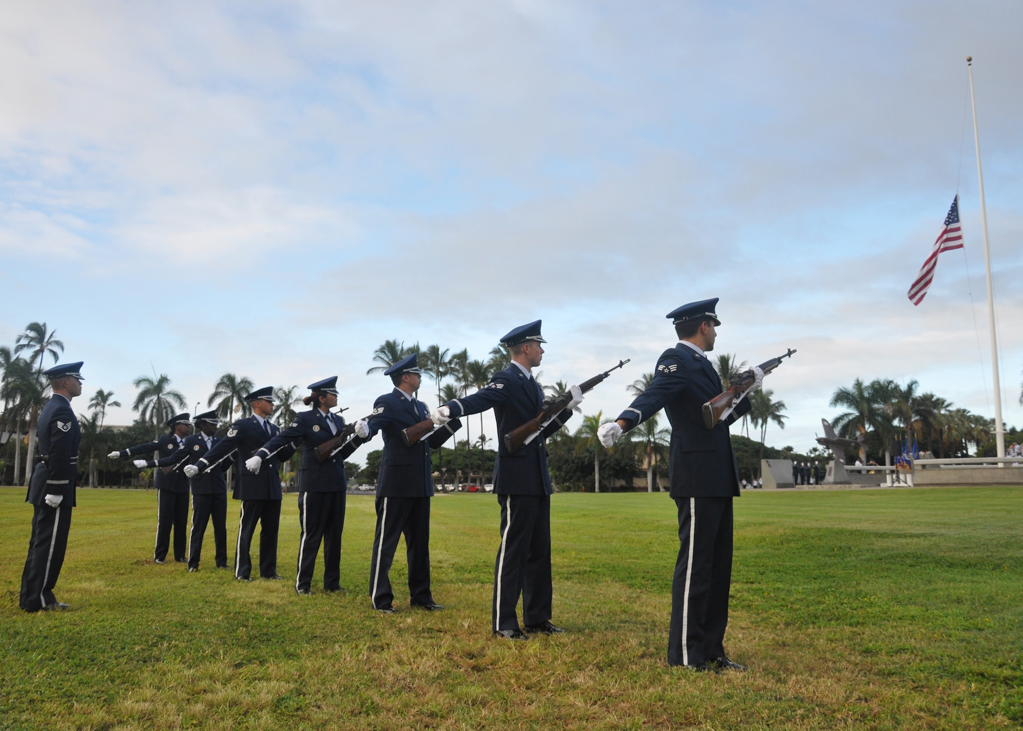 HICKAM AIR FORCE BASE, Hawaii -- The Hickam Air Force Base Honor Guard fires a volley of three rounds to pay tribute to the U.S. servicemembers who gave their lives during the Dec. 7, 1941 attacks on Hickam Field. The remembrance ceremony marked the 68th anniversary of the Dec. 7, 1941, attacks on Pearl Harbor Navy Fleet and the Army Air Corps fields of Hickam, Wheeler and Bellows. Survivors and their families from the infamous day were on hand to pay tribute to their lost brothers and sisters in arms. Survivors and their families from the infamous day were on hand to pay tribute to their lost brothers and sisters in arms. Wreaths and tokens of honor were laid at the base of the memorial at Atterbury Circle. (U.S. Air Force photo/Staff Sgt. Mike Meares)