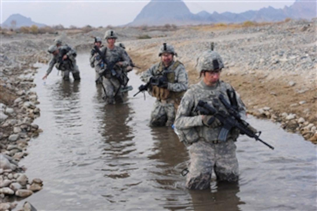 U.S. Army soldiers navigate a stream during a security patrol in Chabar, Afghanistan, on Dec. 3, 2009.  The soldiers are from Charlie Company, 1st Battalion, 17th Infantry Regiment, 5th Brigade Combat Team, 2nd Infantry Division.  