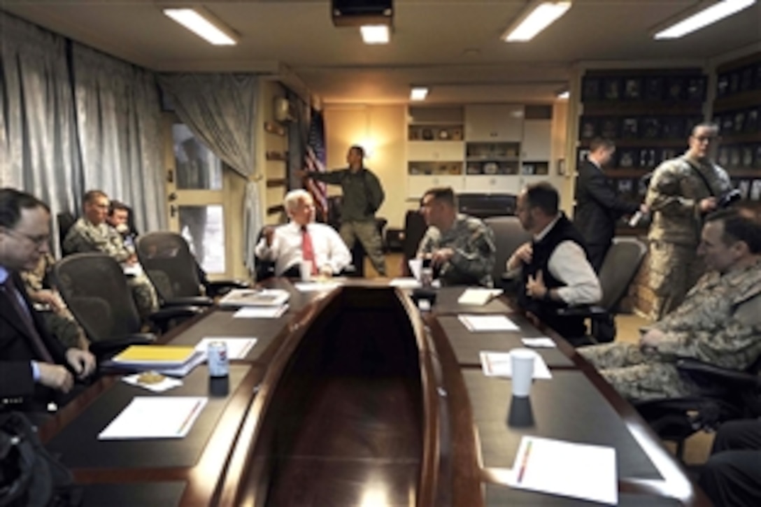U.S. Defense Secretary Robert M. Gates meets with U.S. Army Lt. Gen. David Rodriguez, deputy commander of the International Security Assistance Force, and Lt. Gen. William Caldwell IV, NATO training mission commander, while on Camp Eggers in Kabul, Dec. 8, 2009.