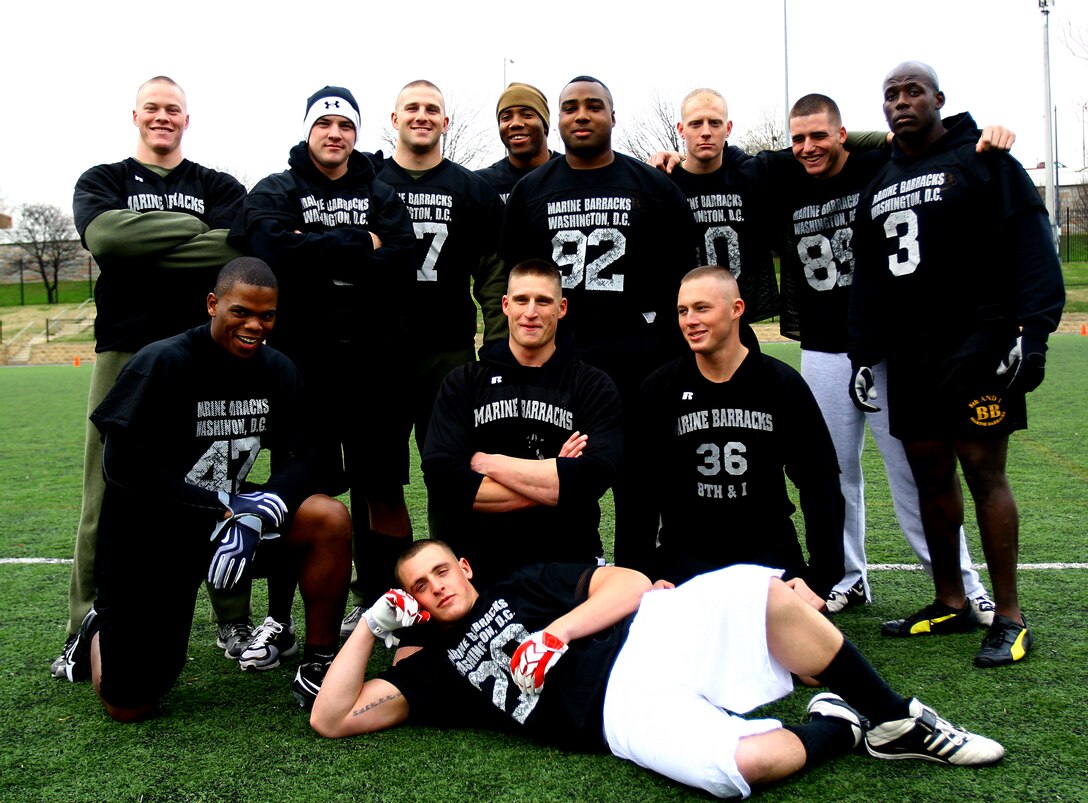 Company B Spartans pose after winning the Marine Barracks Washington Flag Football championship. With the win, the Spartans remained undefeated and finished the season 10-0.