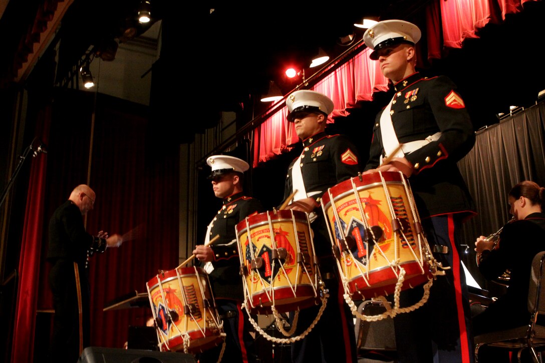 Drummers from the 1st Marine Division Band perform the song The Little Drummer Boy at Camp Pendleton’s base theatre during the Marine Corps Community Services’ Holiday Concert and Expo. Dec. 8. More than 200 Pendleton families attended the festive event that began with an outdoor expo that consisted of numerous activities such as a climbing wall, a paintball shooting booth, bounce houses and rides on ponies dressed as reindeer.::r::::n::::r::::n::