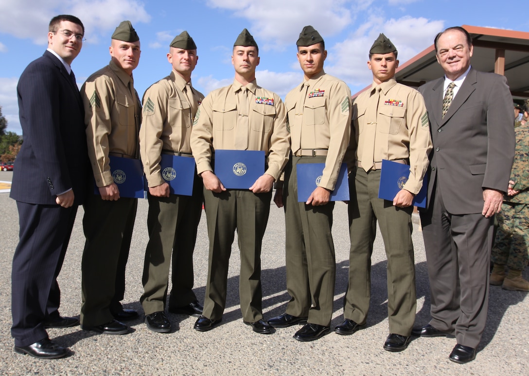 (Left to right) Congressional Representative Ryan D. Peters, sniper team members Sgt. Grant L. Royal and Sgt. Josh W. Huskey, sniper team coach Gunnery Sgt. Andrew Sullivan, sniper team members Sgt. Jose R. Lucero and Sgt. Daniel S. Gilland, and Congressional Representative Don McKinney, proudly stand together after Congressional Recognition Awards were presented to Camp Pendleton’s Scout Sniper School West teams on behalf of Congressman Darrell E. Issa, 49th California Congressional District, U.S. House of Representatives, at Camp Pendleton’s Marine Corps Combat Training graduation, Dec 8.