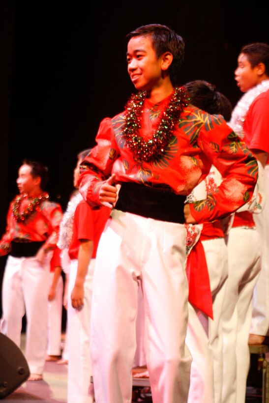 Members of the Honolulu Boy Choir perform a traditional hula and sing during the Second Annual Na Mele o na Keiki, 'Music for the Children' Toys for Tots concert Dec. 9 at the Neal S. Blaisdell Concert Hall. (Official U.S. Marine Corps photo by Sgt. Scott Whittington) (Released)