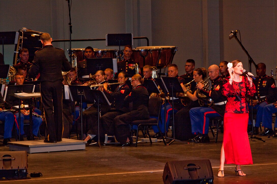 Singer Anita Hall sings ‘Joy to the World,’ accompanied by the U.S. Marine Corps Forces, Pacific Band during the Second Annual Na Mele o na Keiki, 'Music for the Children' holiday concert Dec. 9 at the Neal S. Blaisdell Concert Hall. (Official U.S. Marine Corps photo by Cpl. Cristina Noelia Gil) (Released)