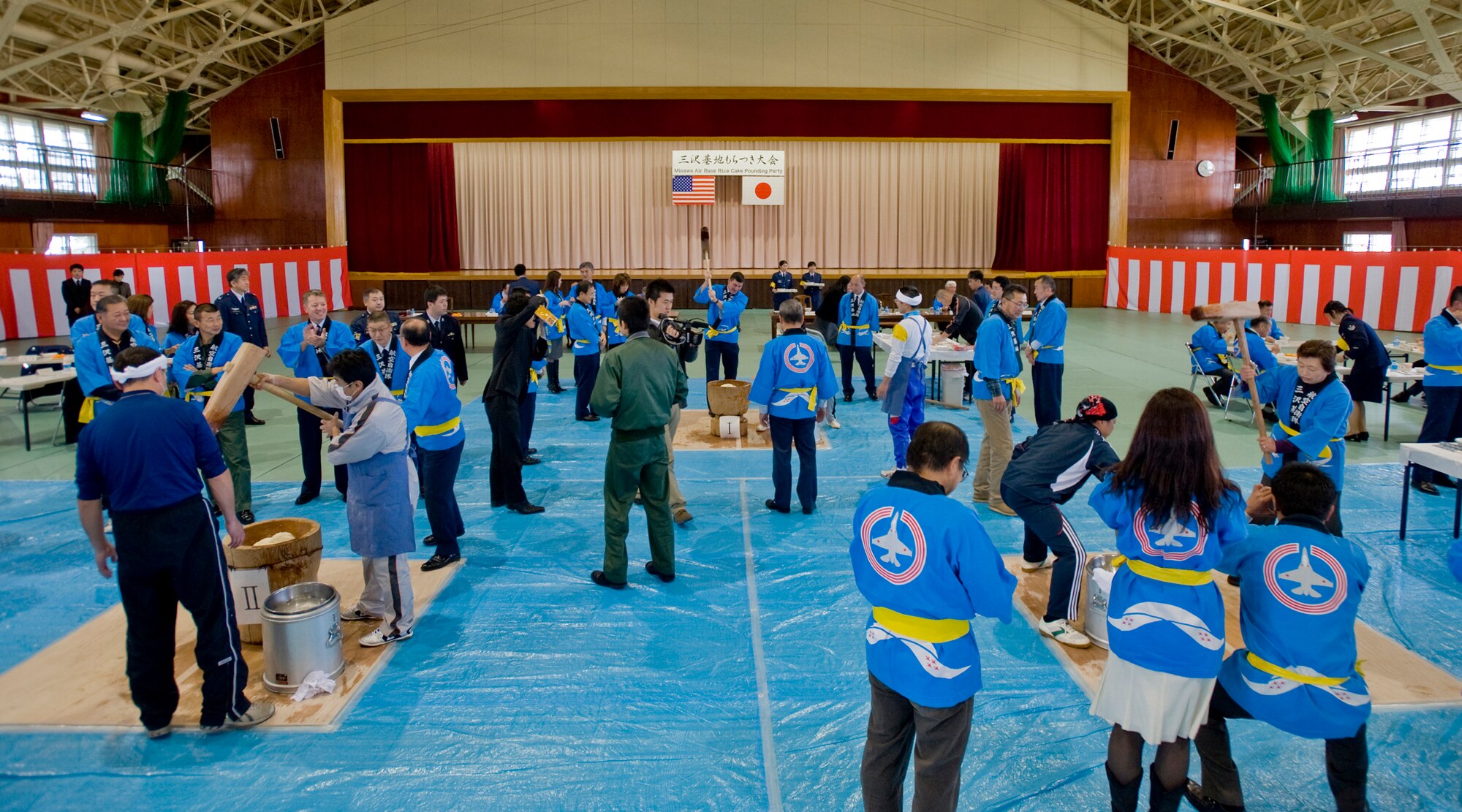MISAWA AIR BASE, Japan -- Members of the 35th Fighter Wing, Naval Air Facility, Japan Air Self-Defense Force and Misawa City Hall participate in the annual Misawa Air Base Rice Cake Pounding Party Dec. 9 at the JASDF gymnasium. The ceremony allowed American guests to interact with their Japanese hosts, while offering an opportunity to learn more about the Japanese New Year's tradition. (U.S. Air Force photo/Senior Airman Jamal D. Sutter)