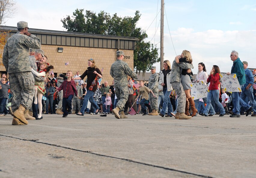 MOODY AIR FORCE BASE Ga. -- Airmen from the 822nd Security Forces Squadron return home after a deployment to family members and friends here Dec. 8. The 822nd SFS was deployed to Camp Bucca, Iraq, and during the deployment, the squadron executed joint expeditionary taskings and performed outside-the-wire security operations and convoy escort. (U.S. Air Forces photo by Airman 1st Class Joshua Green)