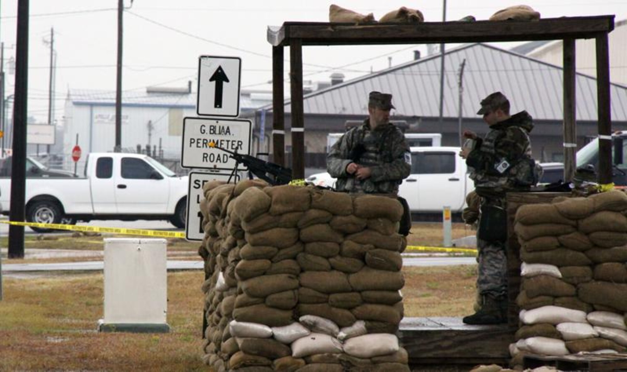 Members from the 911th Airlift Wing Security Forces members deployed to Gulfport Miss. in support of Operation Crisis Reach, stand vigilant prior to a base attack on Dec. 7, 2009. Airmen participated in the operational readiness inspection, which tests a Wing’s ability to operate and survive in a deployed environment.  DISCLAIMER: The Airmen in the photo are participating in an EXERCISE environment, what is depicted in the photo is not to be considered an actual real world event. 