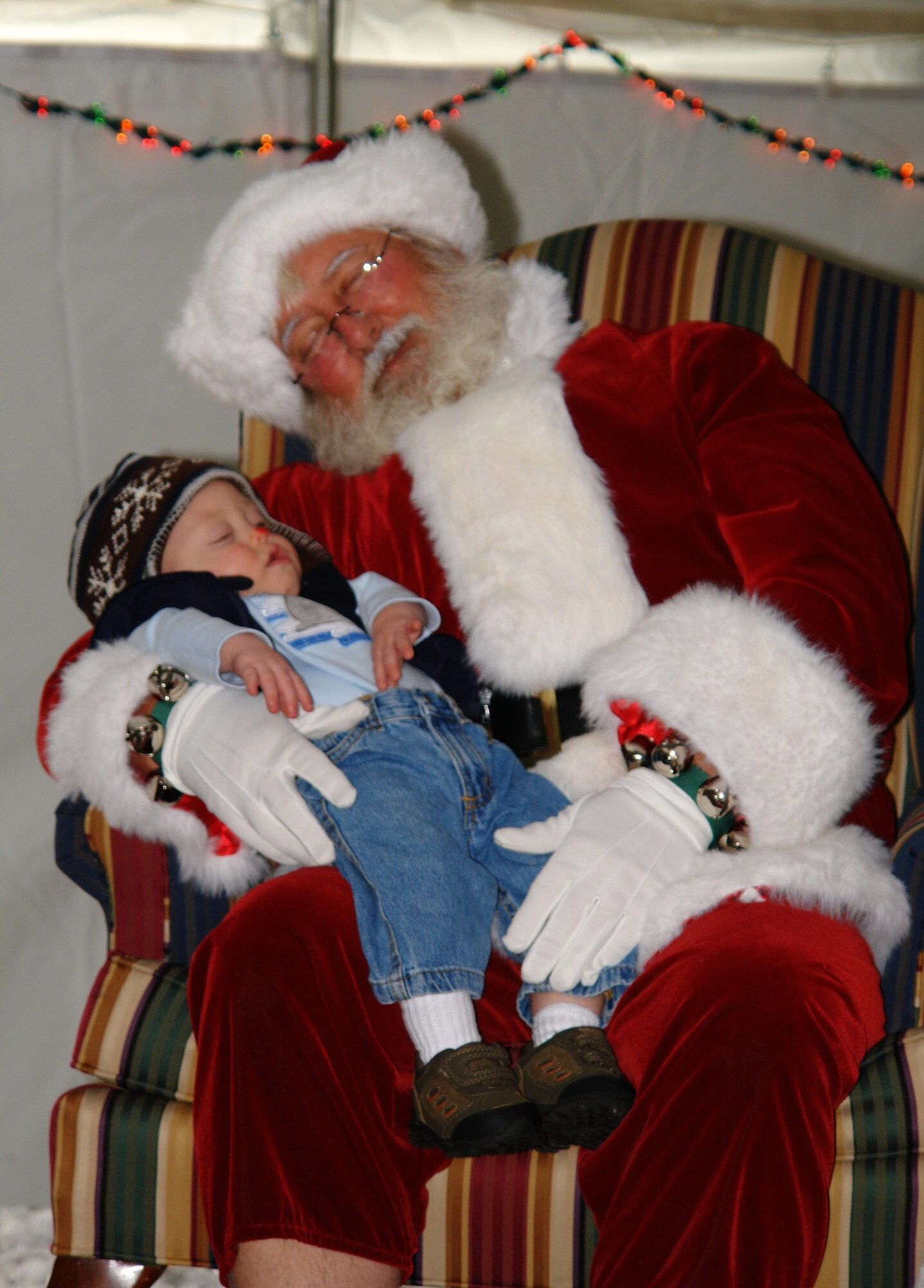 Fourteen-month old Corbin Morris takes a quick snooze with Santa at the Children’s Christmas Party Dec. 6 at the Arnold Lakeside Center at Arnold Air Force Base. Corbin is the grandson of Clarence and Connie Rogers who are both employed through Aerospace Testing Alliance. (Photo by Andrea Stephens)