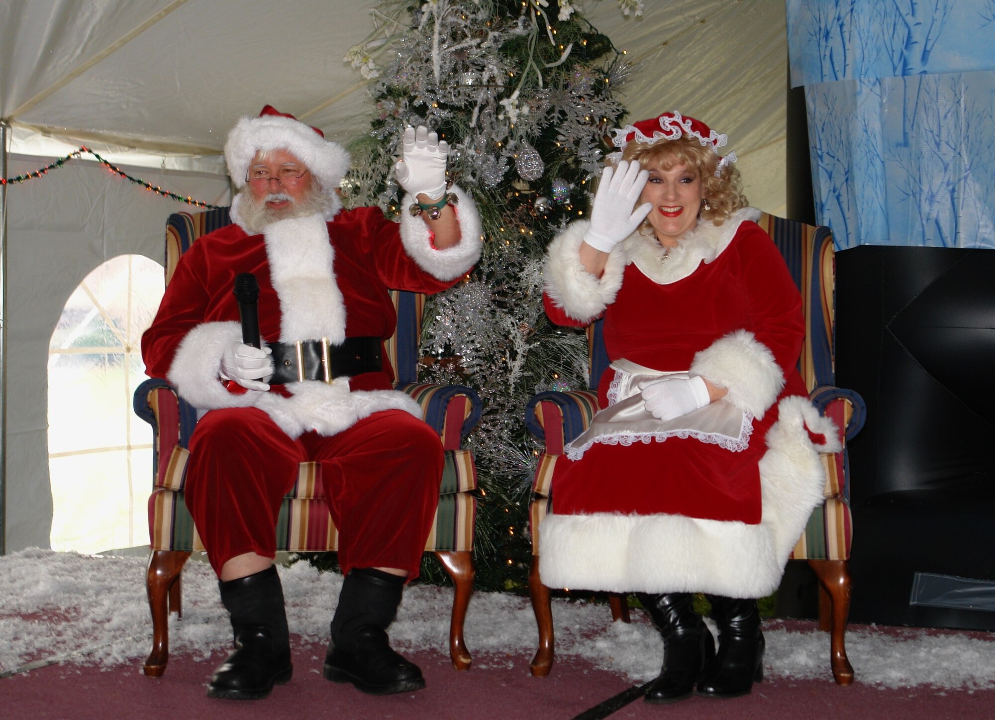 Santa and Mrs. Claus waive party attendees on to come take photos with them at the Children’s Christmas Party Dec. 6 at the Arnold Lakeside Center at Arnold Air Force Base. (Photo by Andrea Stephens)
