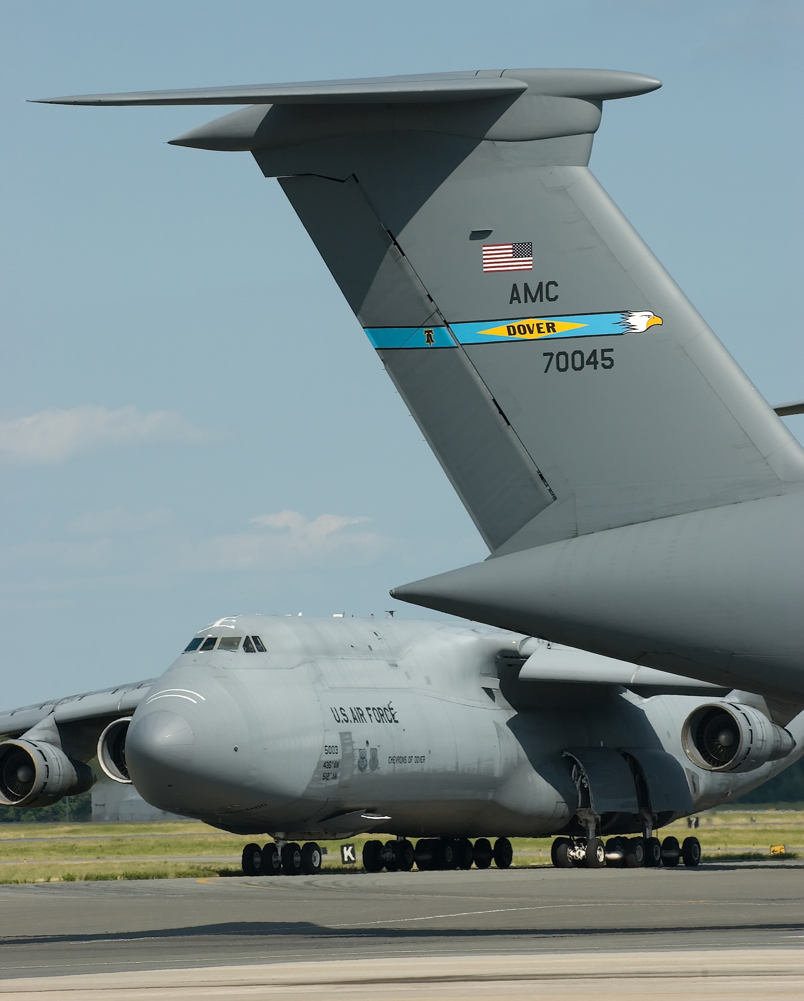 The Dover Air Force Base tail flash as it is seen today with blue to represent the state of Delaware, a diamond for the Diamond State, the Liberty Bell representing the 512th Airlift Wing and the eagle head for the 436th AW. The combination of these symbols represents the Team Dover mentality. (U.S. Air Force photo/Jason Minto)