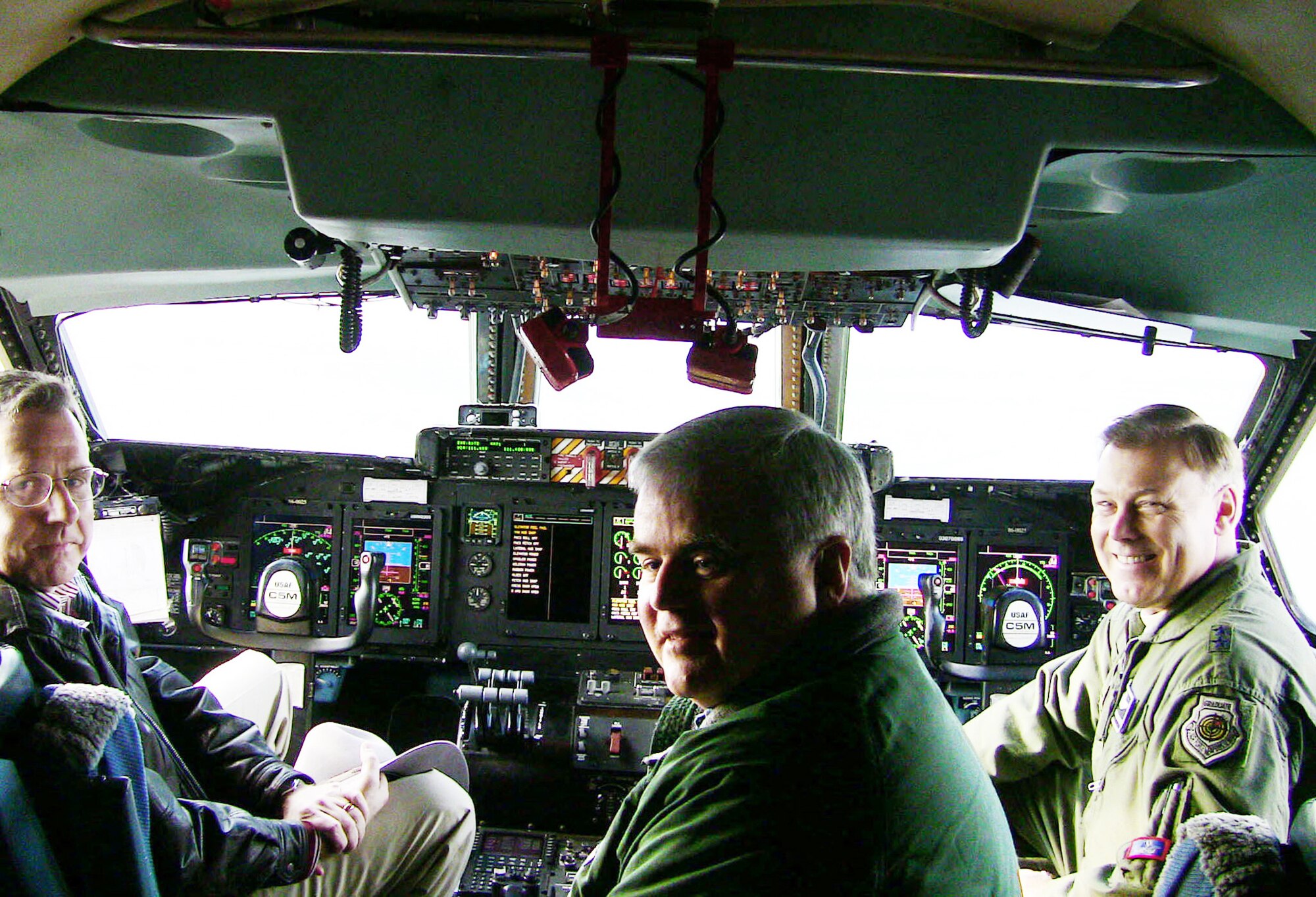 Dr. J. Michael Gilmore (left to right) Mike Crisp and Maj. Gen. Stephen T. Sargeant fly on a C-5M Super Galaxy sortie Dec. 7, 2009, at Dover Air Force Base, Del. The sortie was part of qualification operational test and evaluation being performed on the C-5M. Dr. Gilmore is the director of Operational Test and Evaluation, Mr. Crisp is the DOT&E deputy director of air warfare, and General Sargeant is the Air Force Operational Test and Evaluation Center commander.  (U.S. Air Force photo/Lt. Col. Robert Griffith)