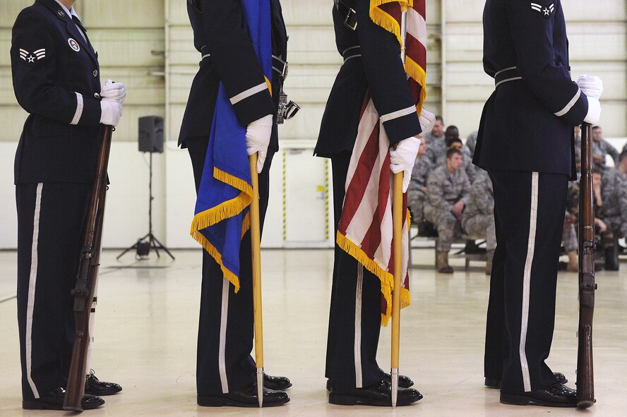 MOODY AIR FORCE BASE, Ga. -- Airmen from Moody’s Honor Guard await the arrival of the official party during the 23rd Maintenance Group assumption of command ceremony Dec. 7. Col. Neal Robinson was formerly the Chief of the Command, control, intelligence, surveillance, reconnaissance division, for Air Combat Command, Langley Air Force Base, Va., and assumed command of the group. (U.S. Air Force photo by Airman 1st Class Joshua Green)