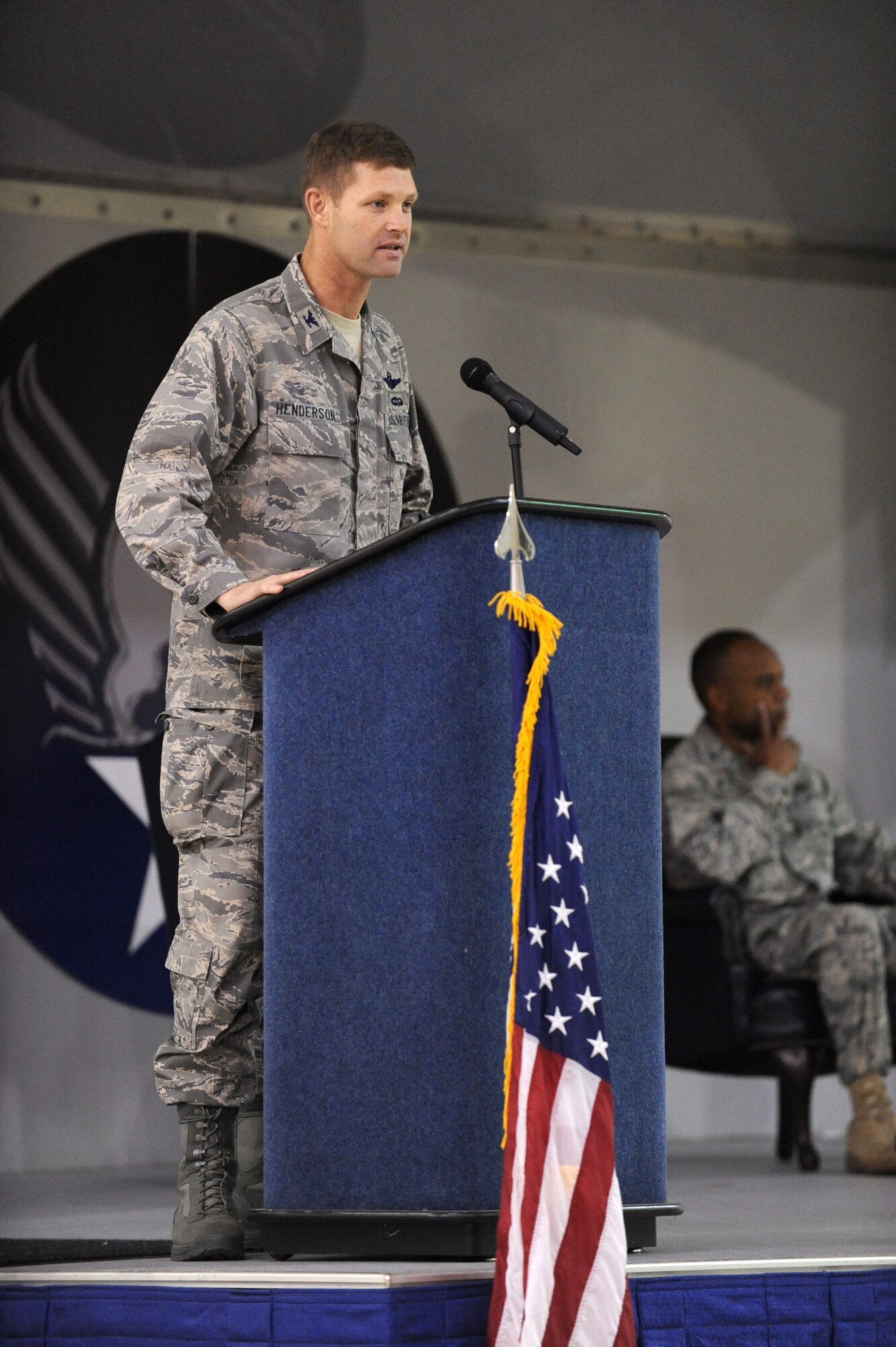 MOODY AIR FORCE BASE, Ga. -- Col. Gary Henderson, 23rd Wing commander, speaks to attendees at the 23rd Maintenance Group assumption of command ceremony here Dec. 7. Col. Neal Robinson assumed command during the ceremony. (U.S. Air Force photo by Airman 1st Class Benjamin Wiseman)