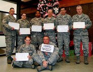 Reservists of Niagara Falls Air Reserve Station?s 914th Services Squadron display care packages sent to them by Ginger Lindner of Clarence American Legion Post Auxiliary 838, Clarence, N.Y. 914th Airmen are currently deployed to the Air Force Mortuary Affairs Operations Center at Dover Air Force Base, Del. (U.S. Air Force photo by Mr. Ed Drohan, AFMAO/PA)