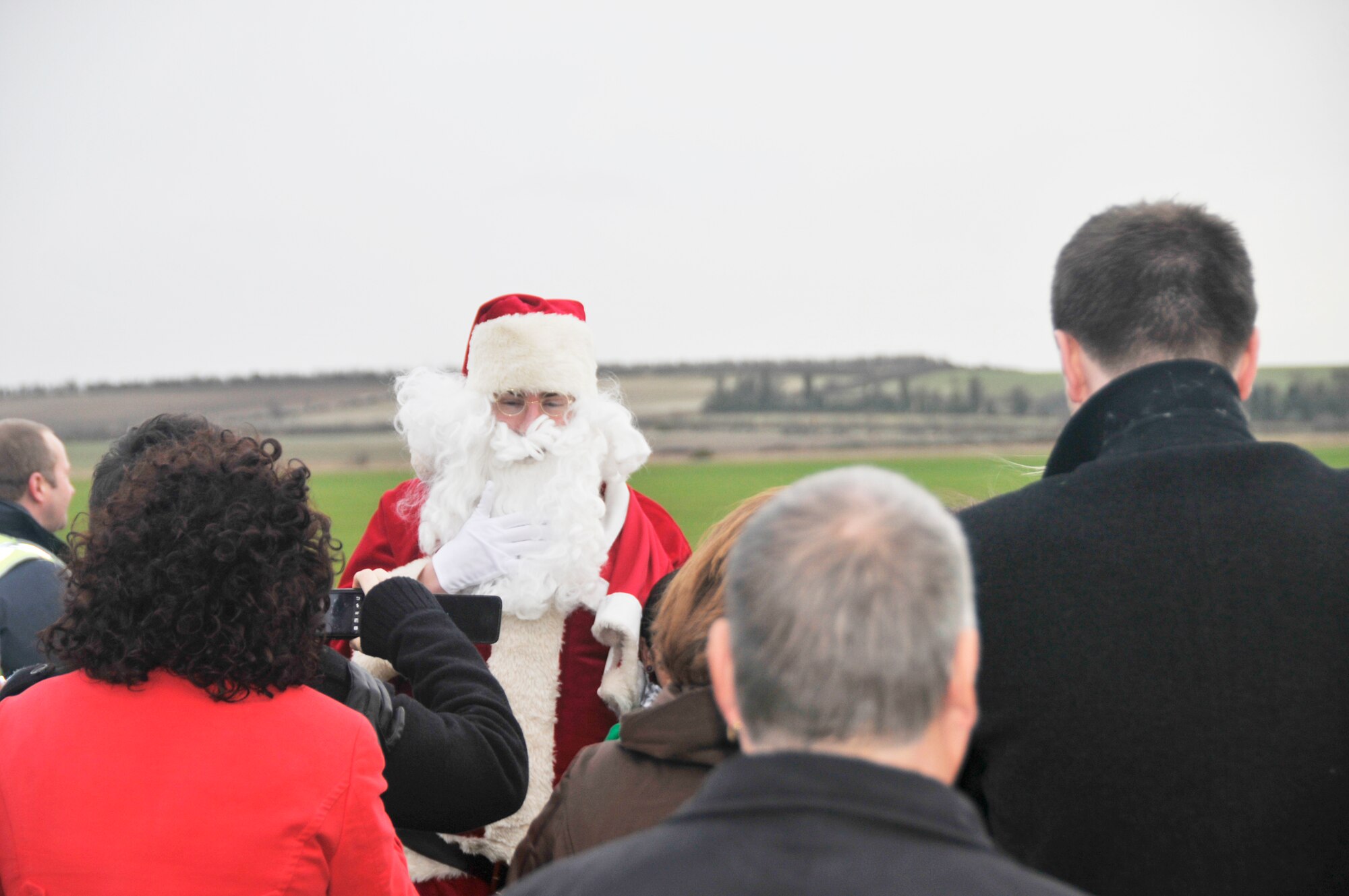 Santa Claus greets people Dec. 5, 2009, at the Imperial War Museum at Duxford, England. Volunteers from the 48th Fighter Wing from Royal Air Force Lakenheath, hosted a party at the museum for terminally and seriously ill children. (U.S. Air Force photo/Tech. Sgt. Chris Stagner)
