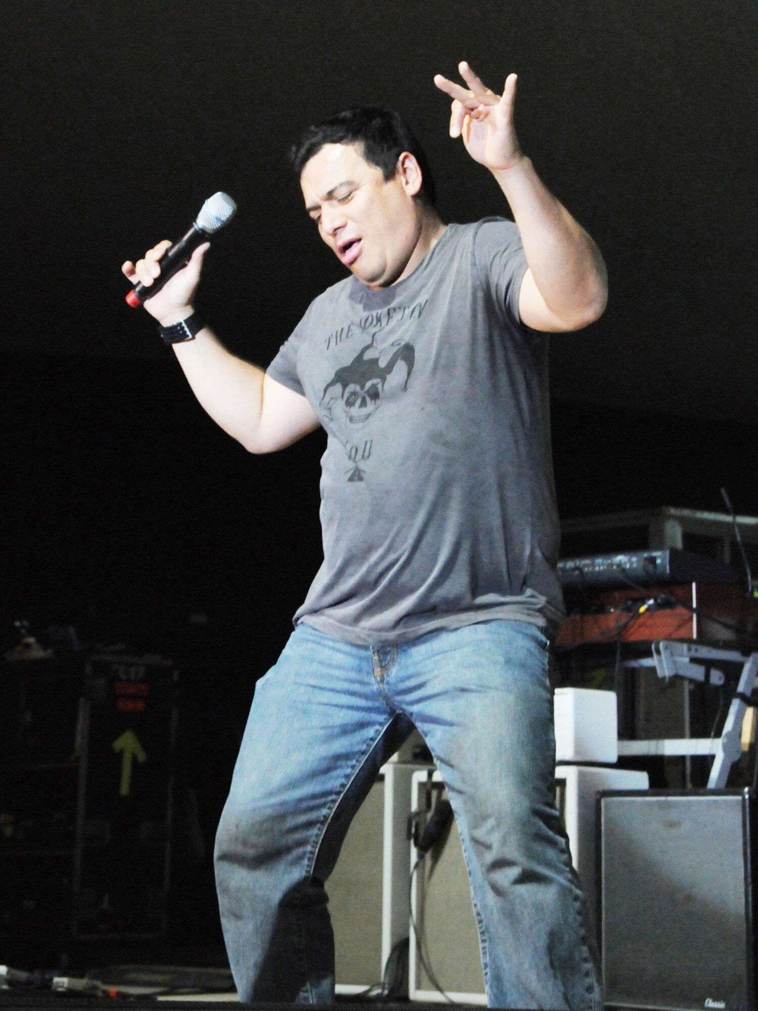 Carlos Mencia performs for a live audience of deployed servicemembers Dec. 6, 2009 at an airbase in Southwest Asia. Tour for Troops 2009 will visit various deployed locations throughout Southwest Asia and Europe and is sponsored by the Air Force Reserve Command. (U.S. Air Force photo/Tech Sgt. Jason W. Edwards)