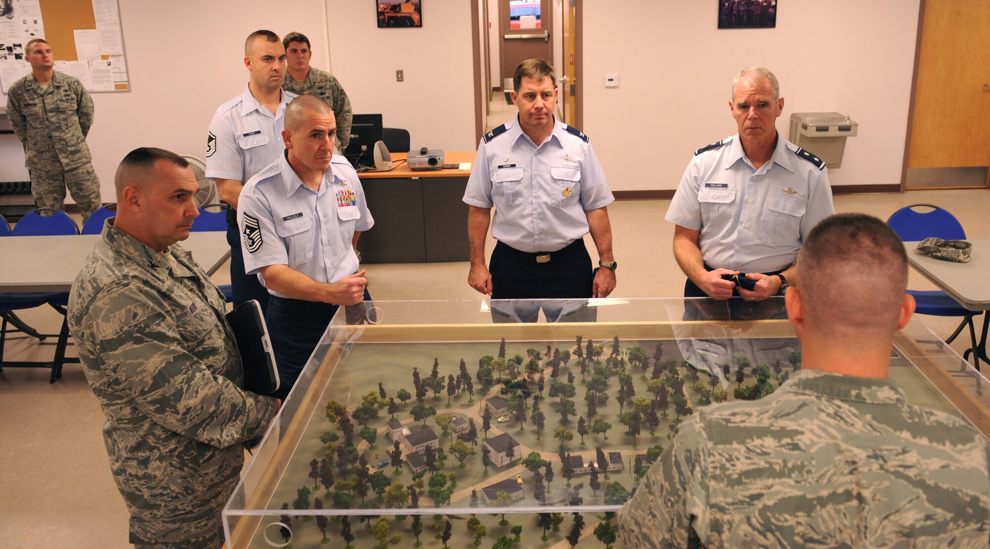 MOODY AIR FORCE BASE, Ga. -- Maj. Gen. William Holland, commander of the 9th Air Force, Air Combat Command, Shaw Air Force Base, S.C., receives a briefing about the 93rd Air Ground Operations Wing, a tenant wing at Moody, from leadership during a base tour,  here Dec. 7. (U.S. Air Force photo by Airman 1st Class Benjamin Wiseman)