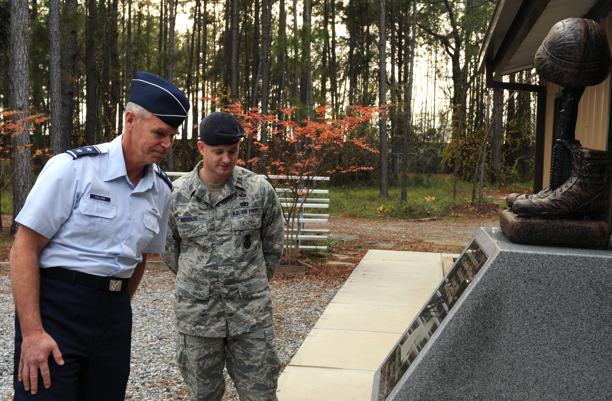 MOODY AIR FORCE BASE, Ga. -- Capt. Jason Medsger, 820th Combat Operations Squadron officer-in-charge of operations, explains the significance of the Airman 1st Class Leebernard Chavis Memorial located outside of the military operations in urban terrain training village to Maj. Gen. William Holland, commander of the 9th Air Force, Air Combat Command, Shaw Air Force Base, S.C., here Dec. 7. The memorial is dedicated to Airman Chavis, who was a member of the 824th Security Forces Squadron. He was killed in action in Iraq in 2006, while performing duties as a turret gunner with his security forces' team on a joint patrol with the Iraqi police. (U.S. Air Force photo by Airman 1st Class Benjamin Wiseman)