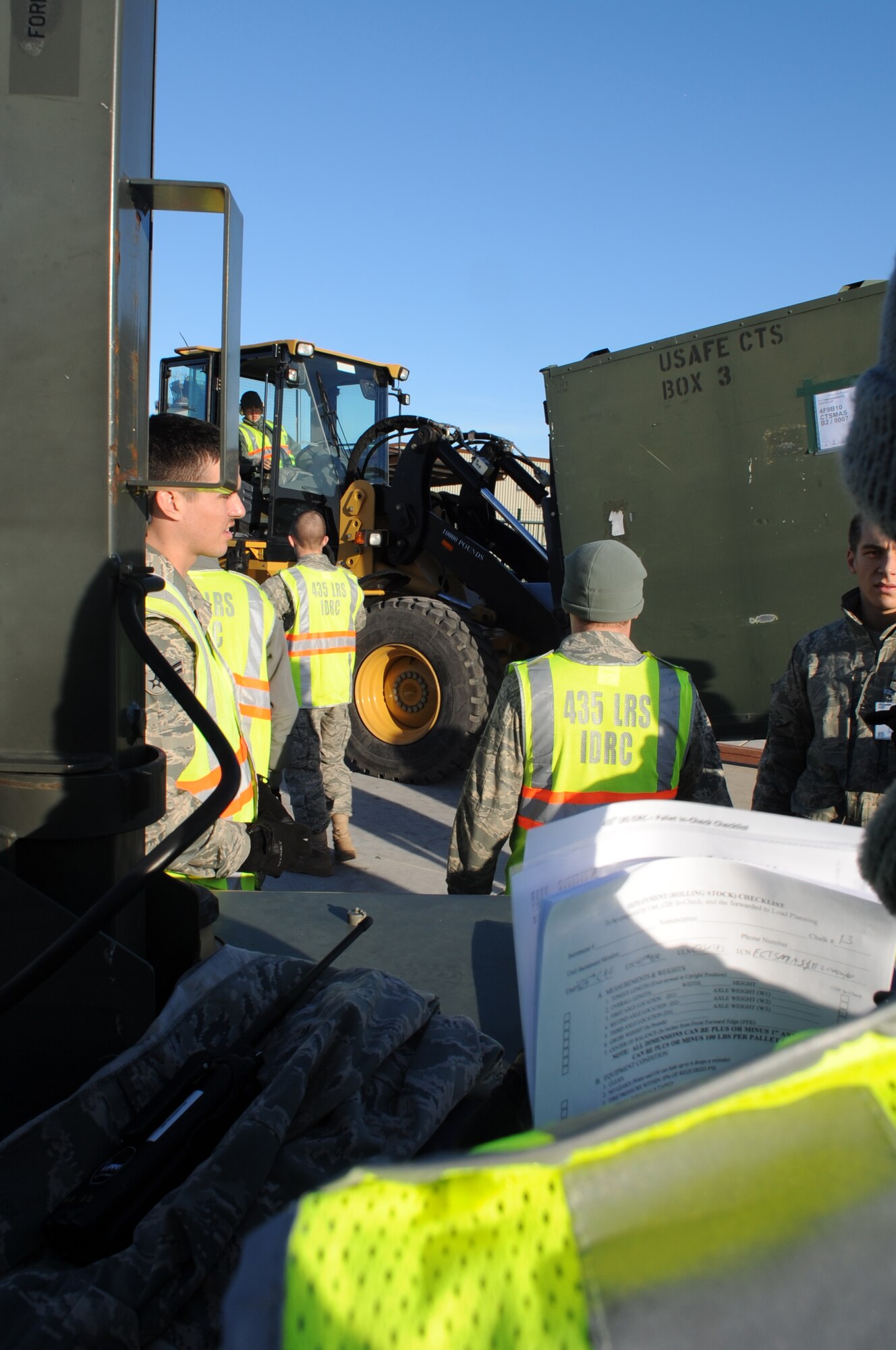 U.S. Air Force 86th Logistics Readiness Squadron members help to get cargo weighed and processed during a base exercise, Ramstein Air Base, Germany Dec. 9, 2009.  This exercise is part of the Phase I of the operation readiness exercises to evaluate mission readiness in preparation for real world deployments. (U.S. Air Force photo by Airman 1st Class Caleb Pierce) 