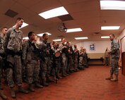 MINOT AIR FORCE BASE, N.D. -- Chief Master Sgt. Martin Smith, 5th Bomb Wing command chief, addresses members of the 5th Security Forces Squadron before the start of their duty day here Dec. 4. Chief Smith visited different work centers in an effort to meet the airmen under his command in a more personal setting. His topics included the need for renewed family values and some specific subjects of the wingman concept. (US Air Force photo by Staff Sgt. Keith Ballard)