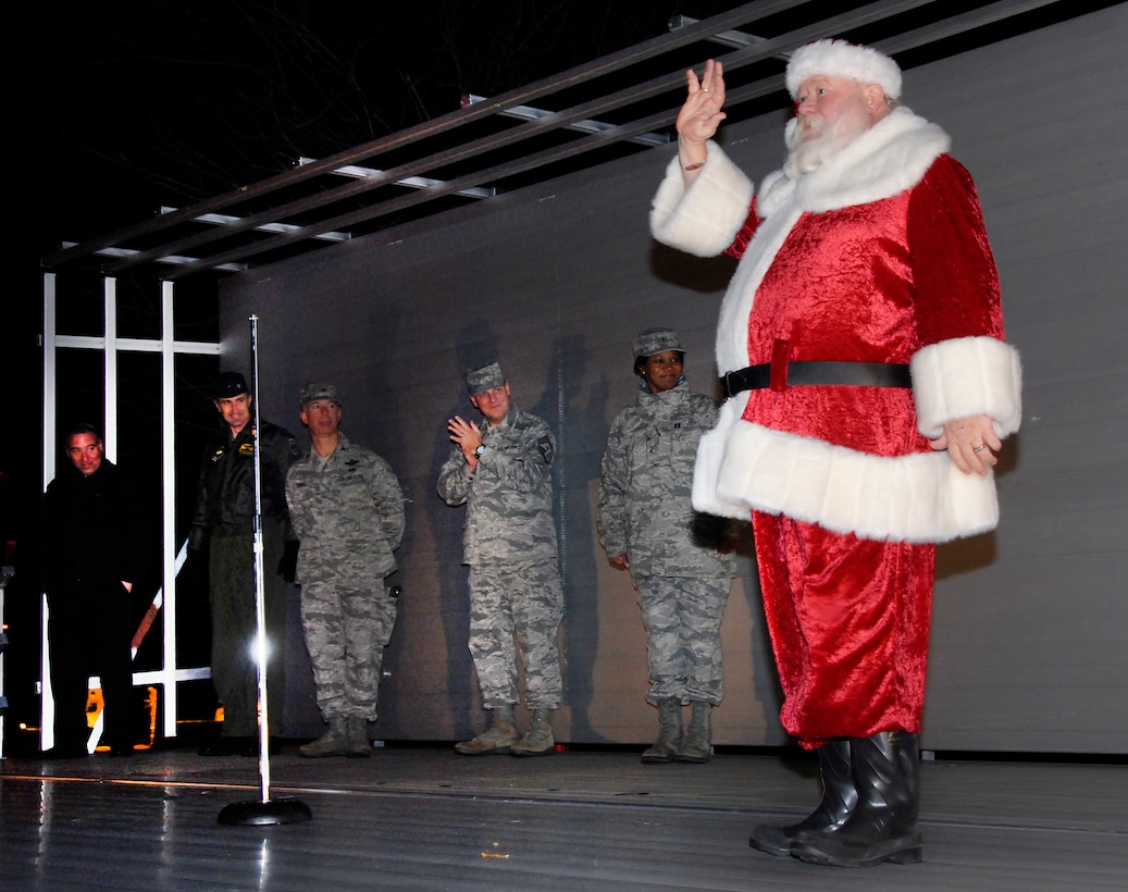 Santa speaks to the audience at the Annual Holiday Tree and Menorah Lighting Dec. 7 at the corner of Avenue E and 1st Avenue. (U.S. Air Force photo/Harry Tonemah)



