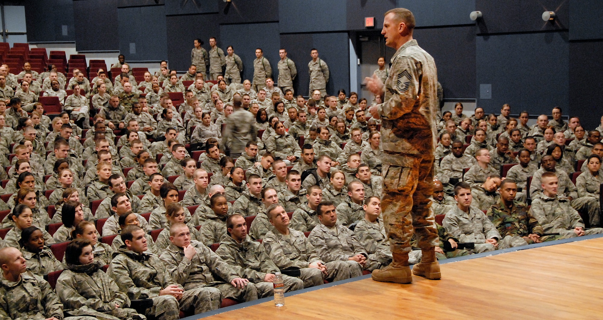 Chief Master Sgt. Charles R. Cole the U.S. Air Force, chief of medical enlisted force speaks to Airmen during his visit Dec. 3 at the base theater. During his meeting with the Airmen he shared stories and answered questions that the Airmen had.(U.S. Air Force photo/ Harry Tonemah) 