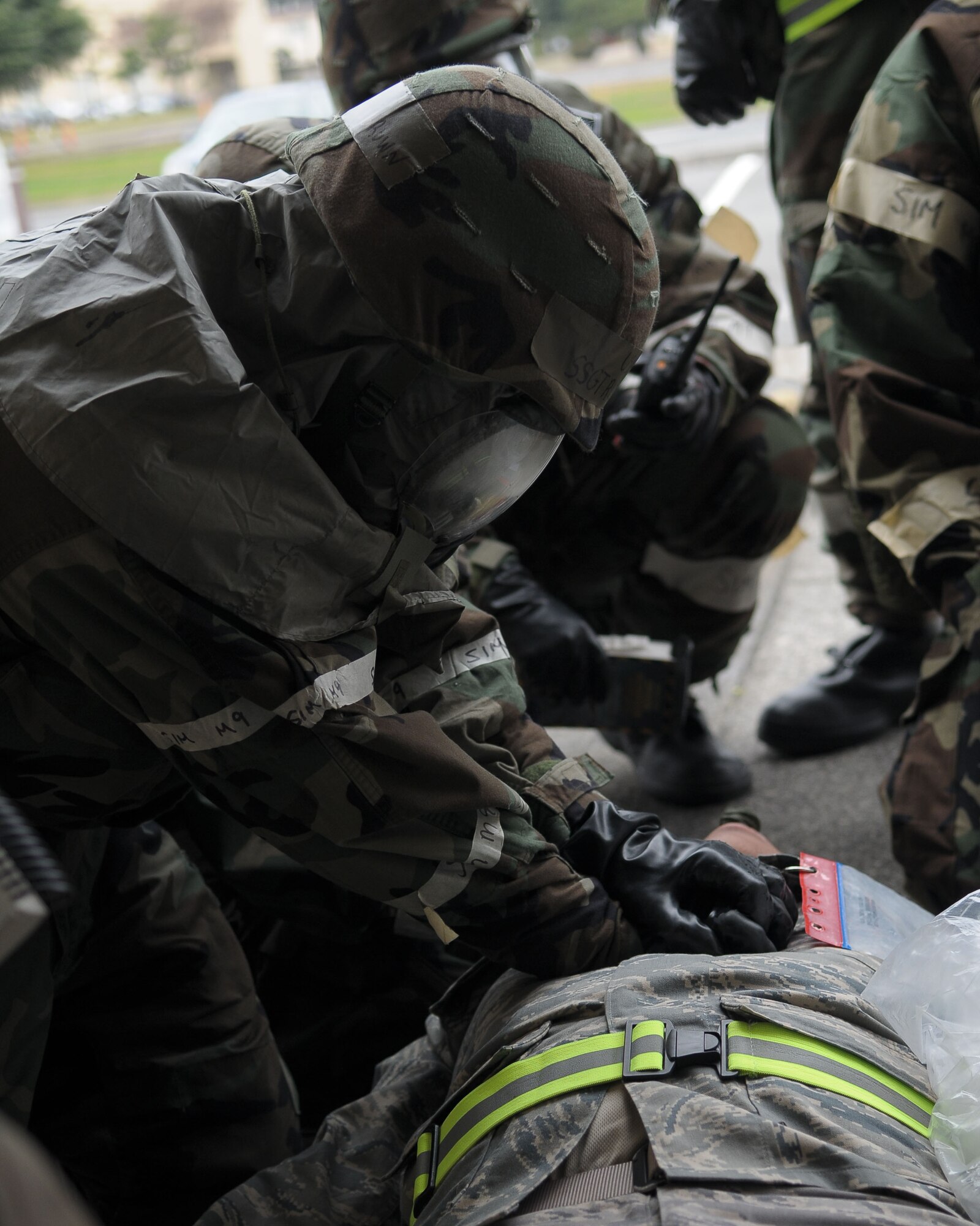 YOKOTA AIR BASE, Japan -- An Airman performs self aid and buddy care on a casualty following a simulated attack Dec. 9 during an operational readiness inspection conducted by the Pacific Air Forces Inspector General. Basic lifesaving steps include: establish an open airway; ensure breathing; stop bleeding to ensure circulation; prevent further disability and minimize further exposure to adverse weather. (U.S. Air Force photo/Airman 1st Class Sean Martin)