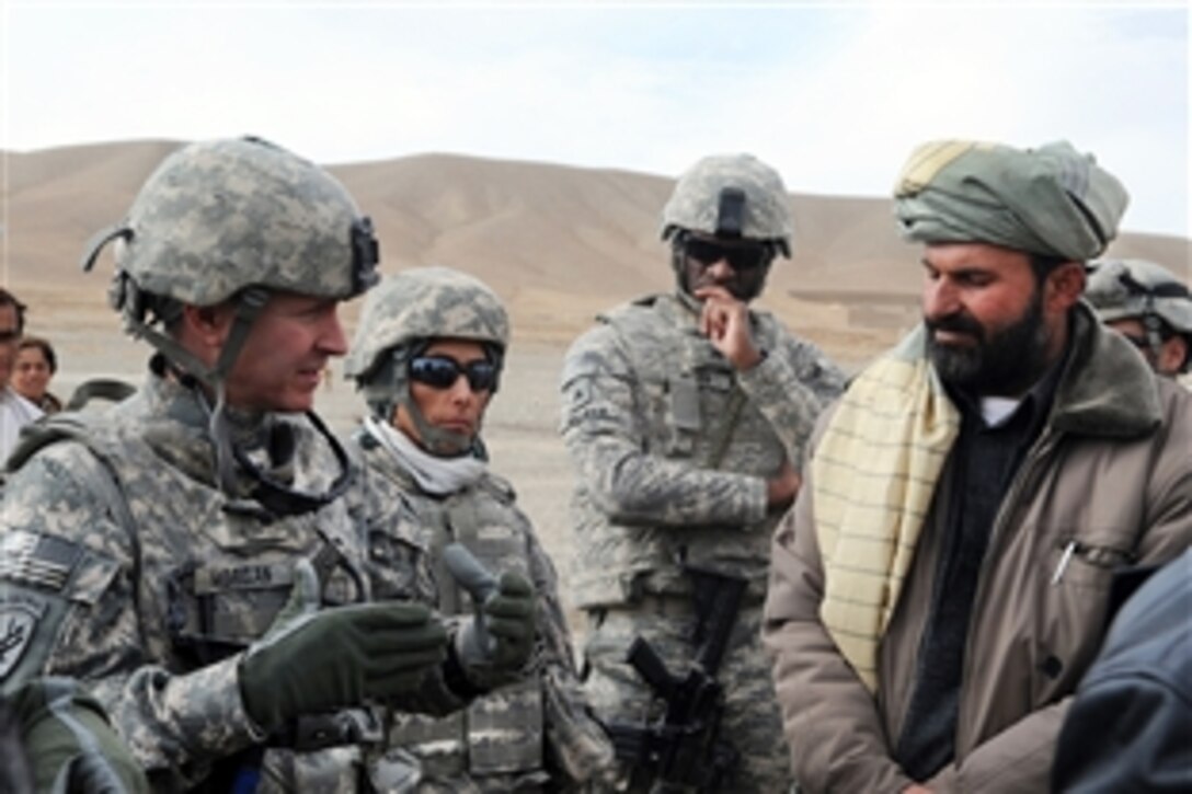U.S. Army Lt. Col. Clayton Morgan  talks with Abdul Mateen, the sub-governor of the Khayr Khot district of Paktika province about a proposed repair project near Seghanna, Afghanistan, Nov. 30, 2009. Morgan is the team leader of the Provincial Reconstruction Team-Paktika civil affairs section.


