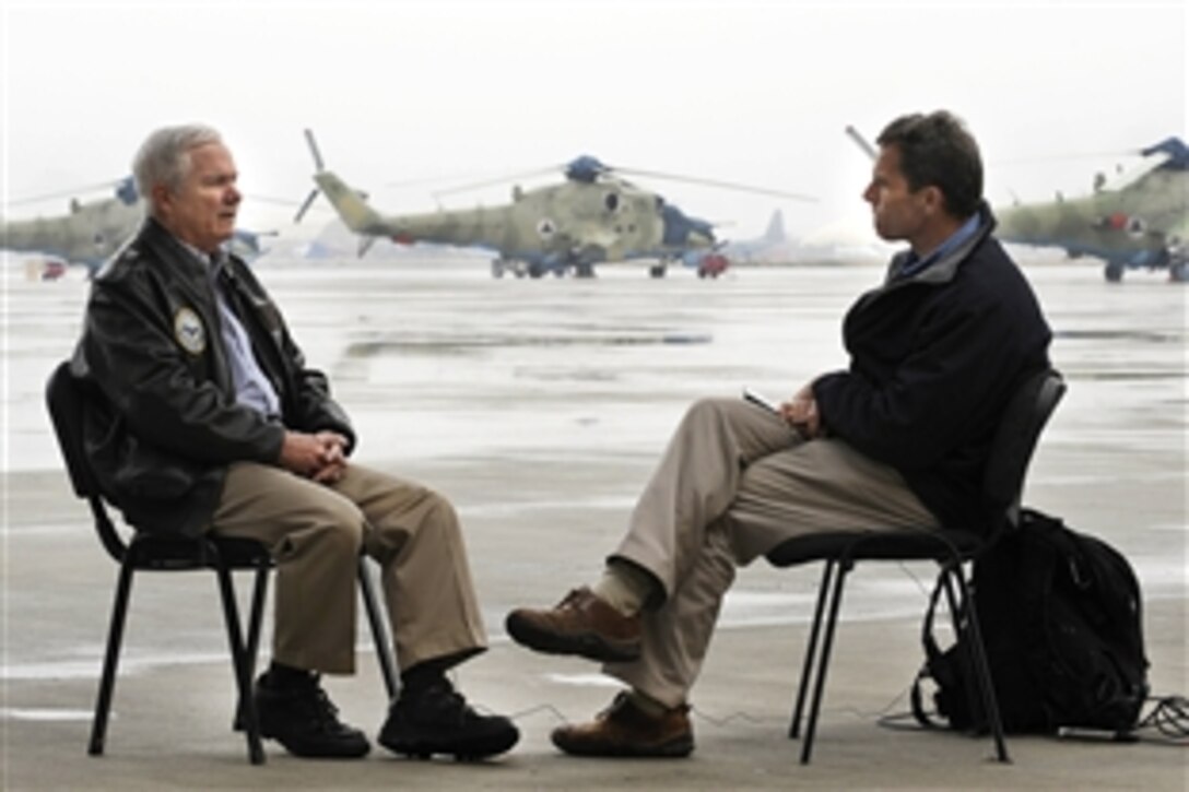 U.S. Defense Secretary Robert M. Gates talks with CBS correspondent Terry McCarthy during an interview in Kabul, Dec. 9, 2009. Gates is on his first trip to Southwest Asia following President Barack Obama's decision to send an additional 30,000 troops to Afghanistan. 