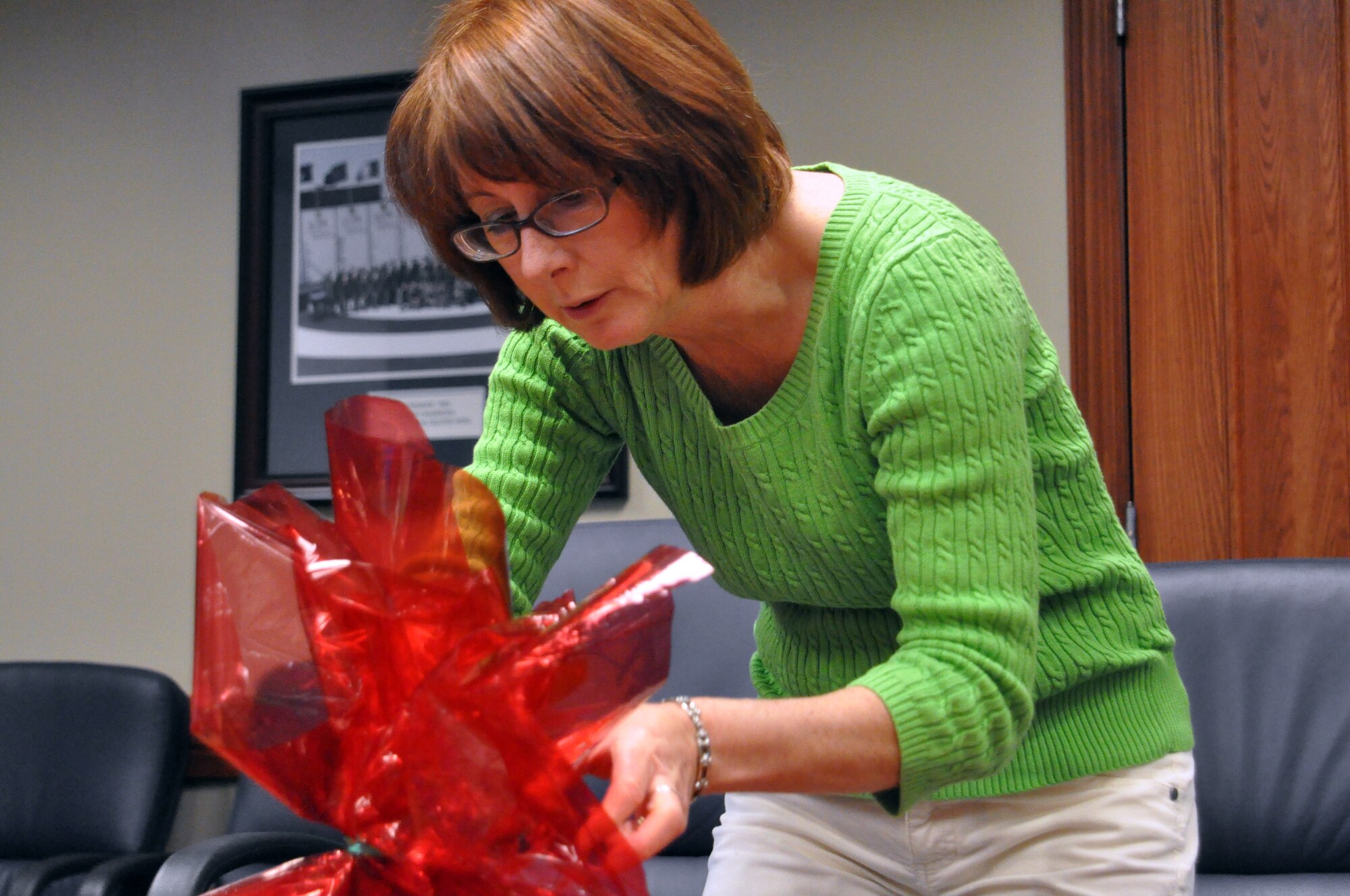 Mrs. Angie Mood, wife of 419th Mission Support Group Commander Col. Charles Mood, puts the finishing touches on a plate of cookies that were delivered to wing personnel during the December UTA. (U.S. Air Force photo/Staff Sgt. Kyle Brasier)