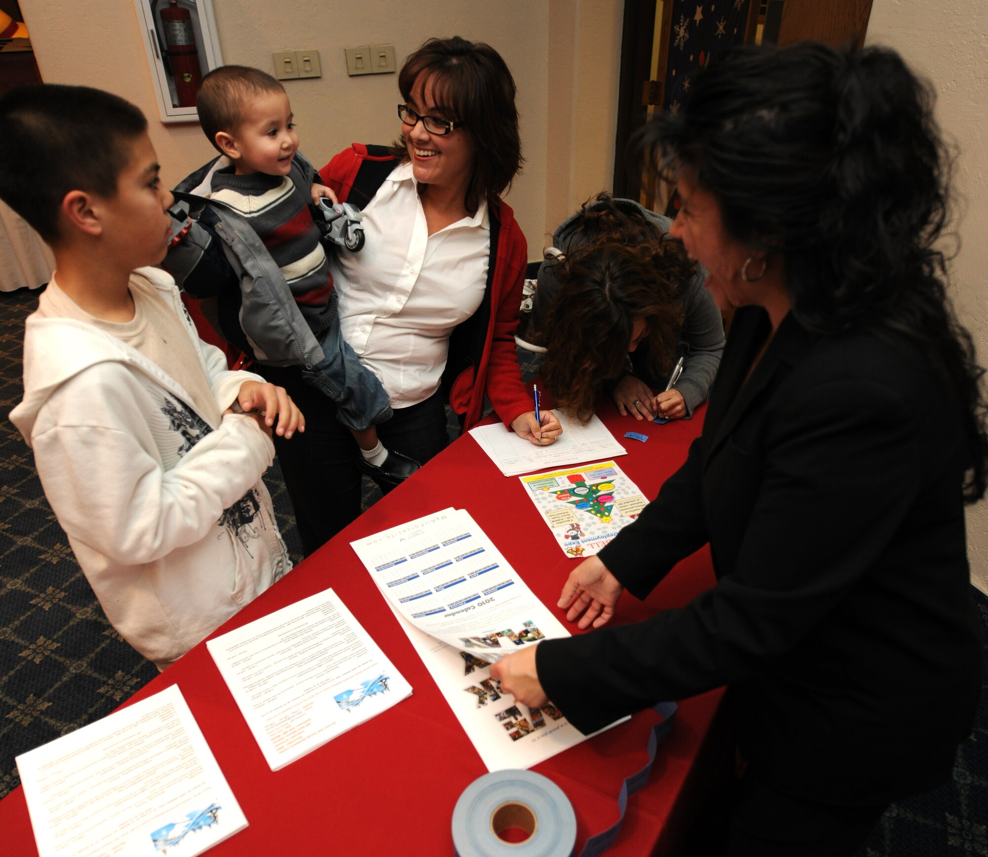 HOLLOMAN AIR FORCE BASE, N.M. -- Members of Team Holloman attend the Families Apart Dinner at the Desert Sands Enlisted Club, Dec. 9. The Airman and Family Readiness Center holds a Families Apart Dinner at least every quarter for spouses and children of deployed members to get together and enjoy a dinner and crafts. The 49th Force Support Squadron hosted the Families Support Dinner in conjunction with the Deployment Expo. (U.S. Air Force photo by Senior Airman Michael Means)