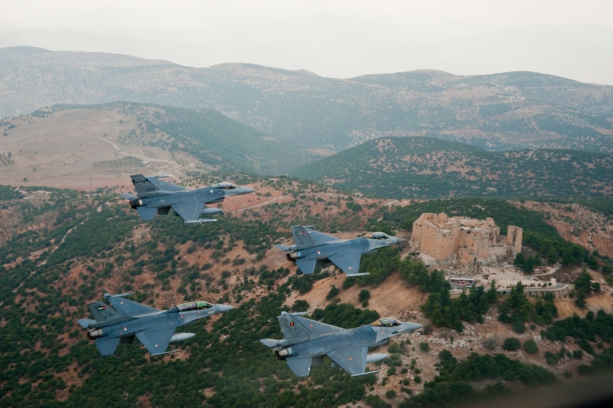 A diamond formation of F-16 Fighting Falcons flies over the ancient castle of Ajloun, located in Ajloun, Jordan, a site of 12th century Arab castle ruins, during a formation flight Nov. 1, 2009. The jets represent the three countries who were participating in the 2009 Falcon Air Meet: Belgium, United States, and Jordan. The Falcon Air Meet is an annual competition for countries around the world that fly F-16 Fighting Falcons. (Official U.S. Air Force photo by Capt. Darin Overstreet, Colorado National Guard/Released)