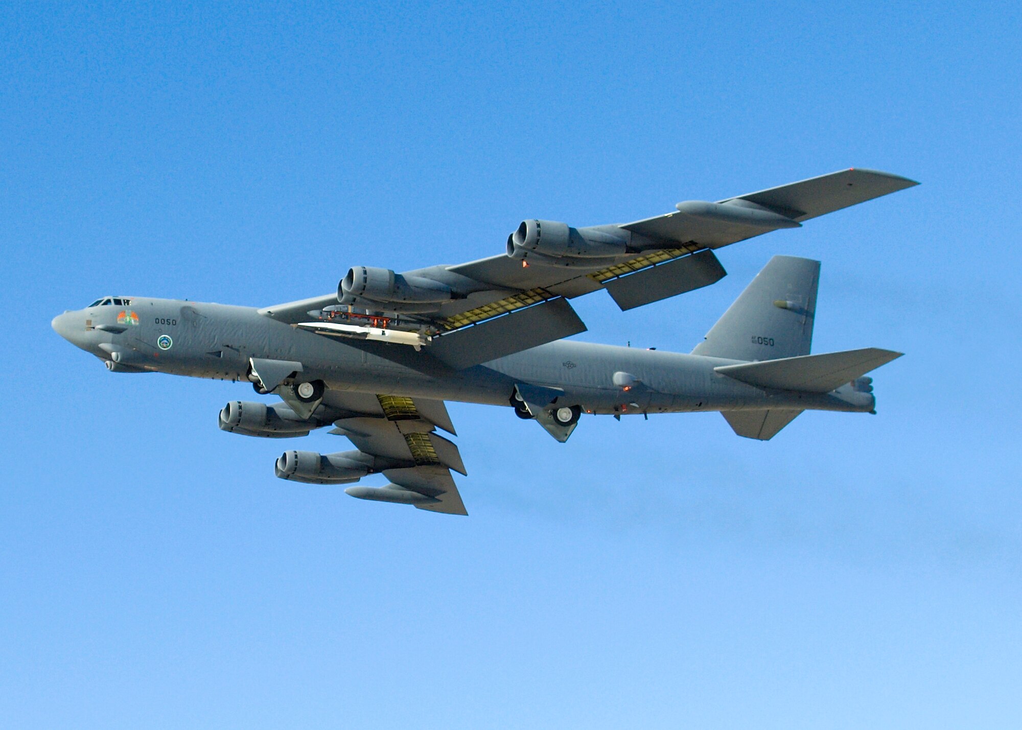 A B-52 Stratofortress performs a captive carry flight of the X-51A Scram Jet Dec. 9. The flight was performed to test the B-52's airwortiness while carrying the X-51A. (U.S. Air Force photo/Mike Cassidy)

