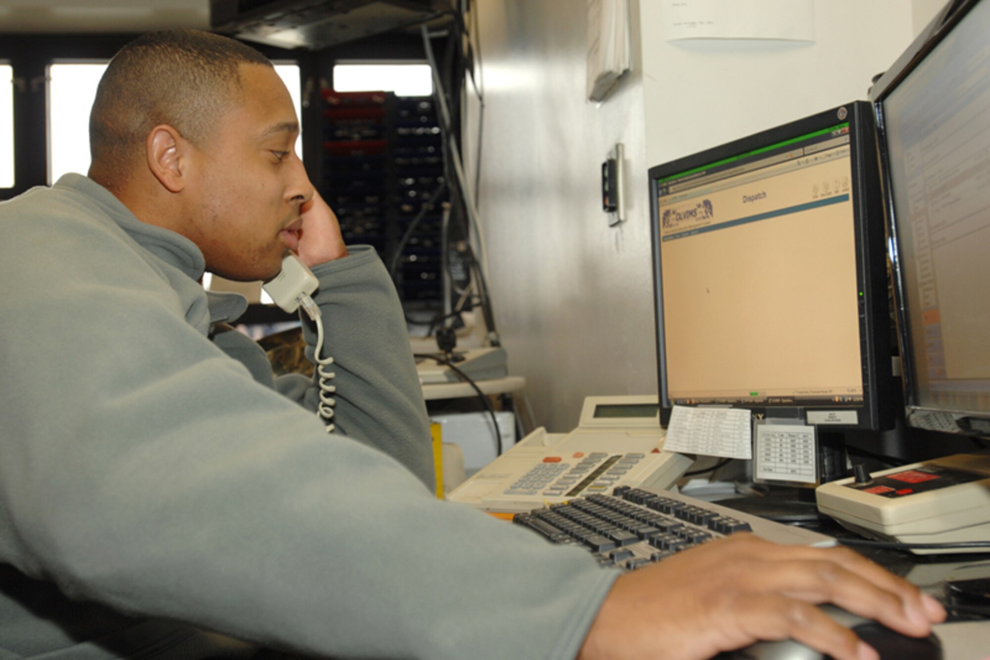 Staff Sgt. Nate Roberts, 22nd Logistics Readiness Squadron vehicle dispatcher, reviews and validates vehicle requests, Dec. 1, 2009, at McConnell Air Force Base, Kan. Vehicle operations Airmen schedule use of and sign out vehicles for customers on base. On average, the office provides 15 government vehicles to requesters per week.  (U.S. Air Force photo/Staff Sgt. Jamie Train)