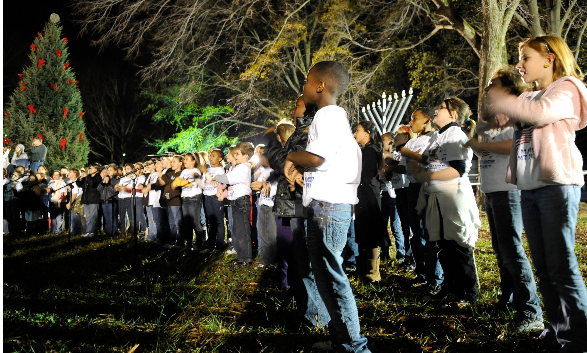 LANGLEY AIR FORCE BASE, Va. — The Bethel Manor Elementary Eagles children choir sings holiday songs during the annual tree-lighting ceremony Dec. 9 at the Bethel Manor Chapel.  The tree was purchased by Team Langley members from Maine, and this year, the event coincides with the Year of the Air Force Family. (U.S. Air Force photo/ Senior Airman Dana Hill)