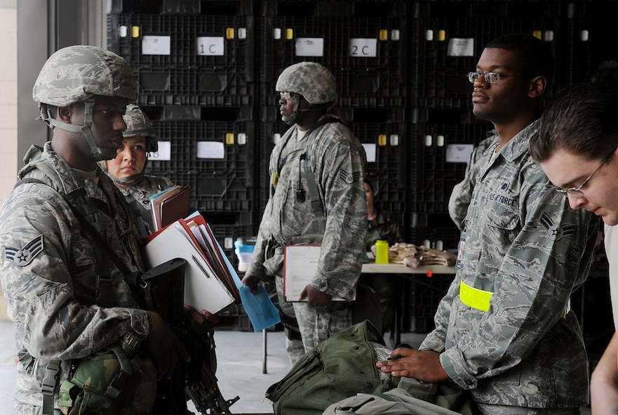 MOODY AIR FORCE BASE, Ga. -- Airmen from the 23rd Wing process through a mobility bag issue line during a Phase I Operational Readiness Exercise here Dec. 8. Moody is preparing for an upcoming Phase I Operational Readiness Inspection scheduled to be in March 2010. (U.S. Air Force photo by Airman 1st Class Joshua Green)