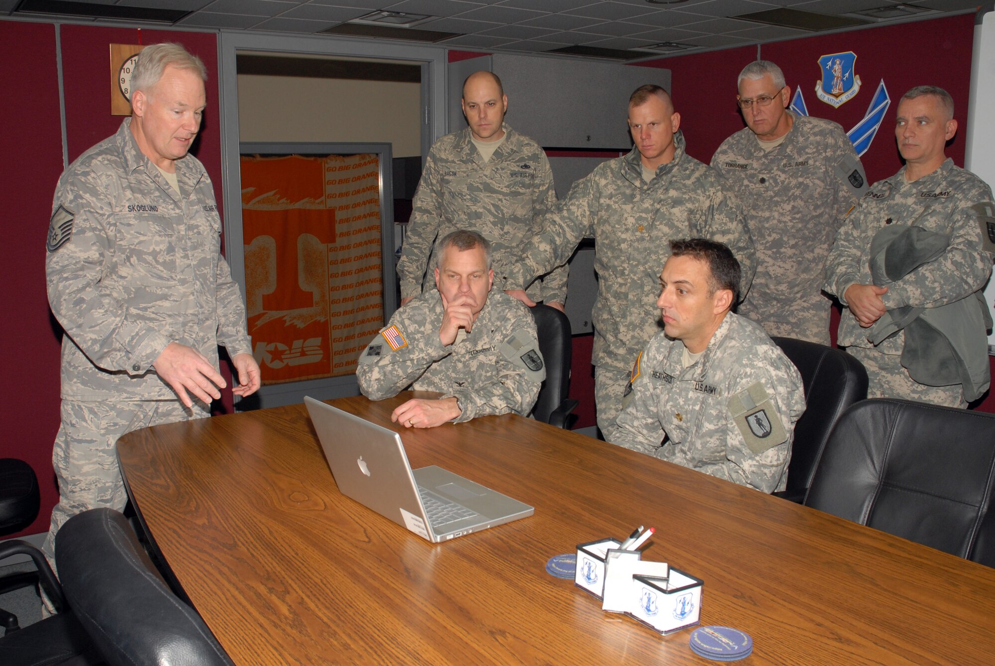 McGHEE TYSON AIR NATIONAL GUARD BASE, Tenn. -- Master Sgt. Kurt Skoglund, photographer, provides a presentation on the graphic design elements used in advanced distributed learning products created by The I.G. Brown Air National Guard Training and Education Center's Transformative Education branch to leadership of The Lavern E. Weber National Guard Bureau Professional Education Center (PEC), Dec. 8, 2009. The PEC visited the center to explore opportunities for collaboration between the Army and Air National Guard training centers. (U.S. Air Force photo by Master Sgt. Mavi Smith/Released)