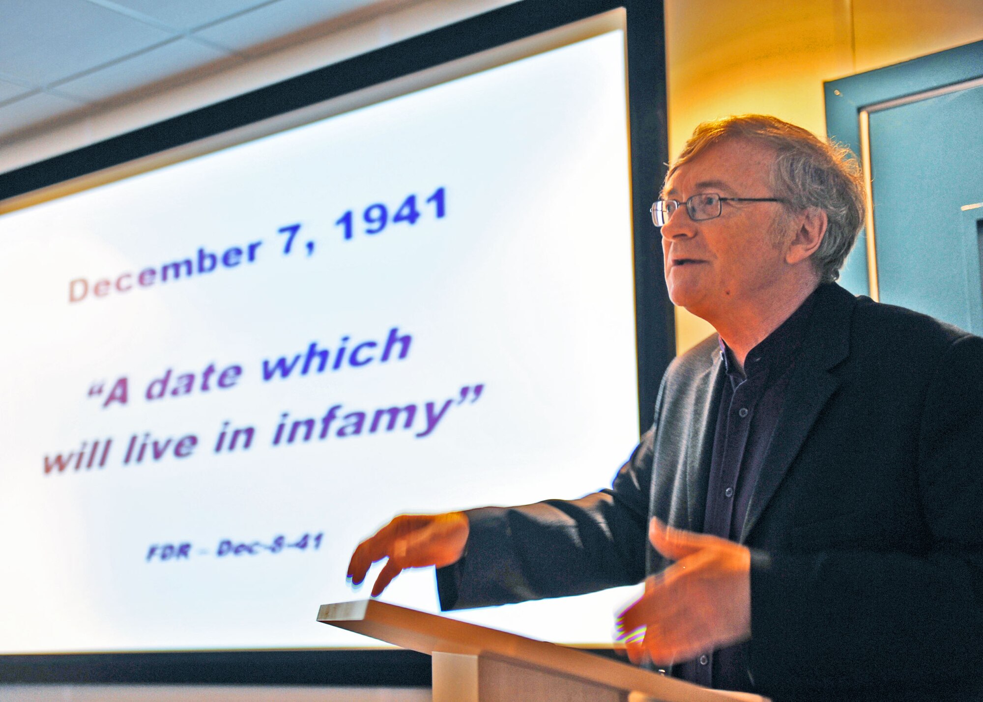 Ken Ellis, Editor of FLYPAST Magazine, a leading UK aviation journal, speaks during the 7 December 2009 commemoration of the 68th anniversary of the Pearl Harbor attack which brought the US into World War Two. (U.S. Air Force photo by Staff Sgt. Javier Cruz)