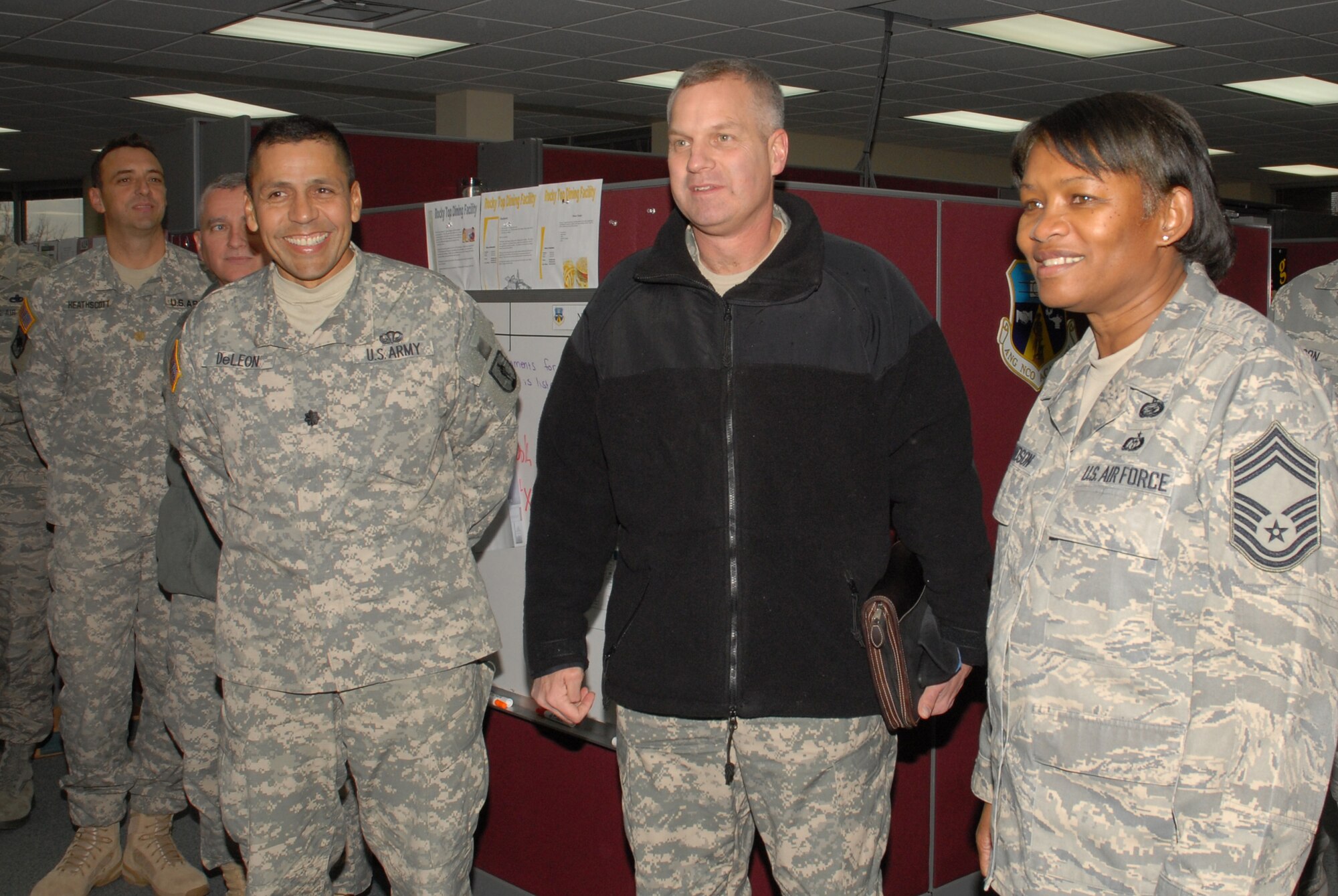 McGHEE TYSON AIR NATIONAL GUARD BASE, Tenn. -- Air Force Chief Master Sgt. Deborah F. Davidson, right, the commandant of the Paul H. Lankford Enlisted Professional Military Education Center, provides a tour of The I.G. Brown Air National Guard Training and Education Center here to The Lavern E. Weber National Guard Bureau Professional Education Center leadership, Army Lt. Col. Tomas DeLeon, left, and Army Col. John M. Frost, center, Dec. 8, 2009.  They visited the center to explore opportunities for collaboration between the Army and Air National Guard training centers. (U.S. Air Force photo by Master Sgt. Mavi Smith/Released)