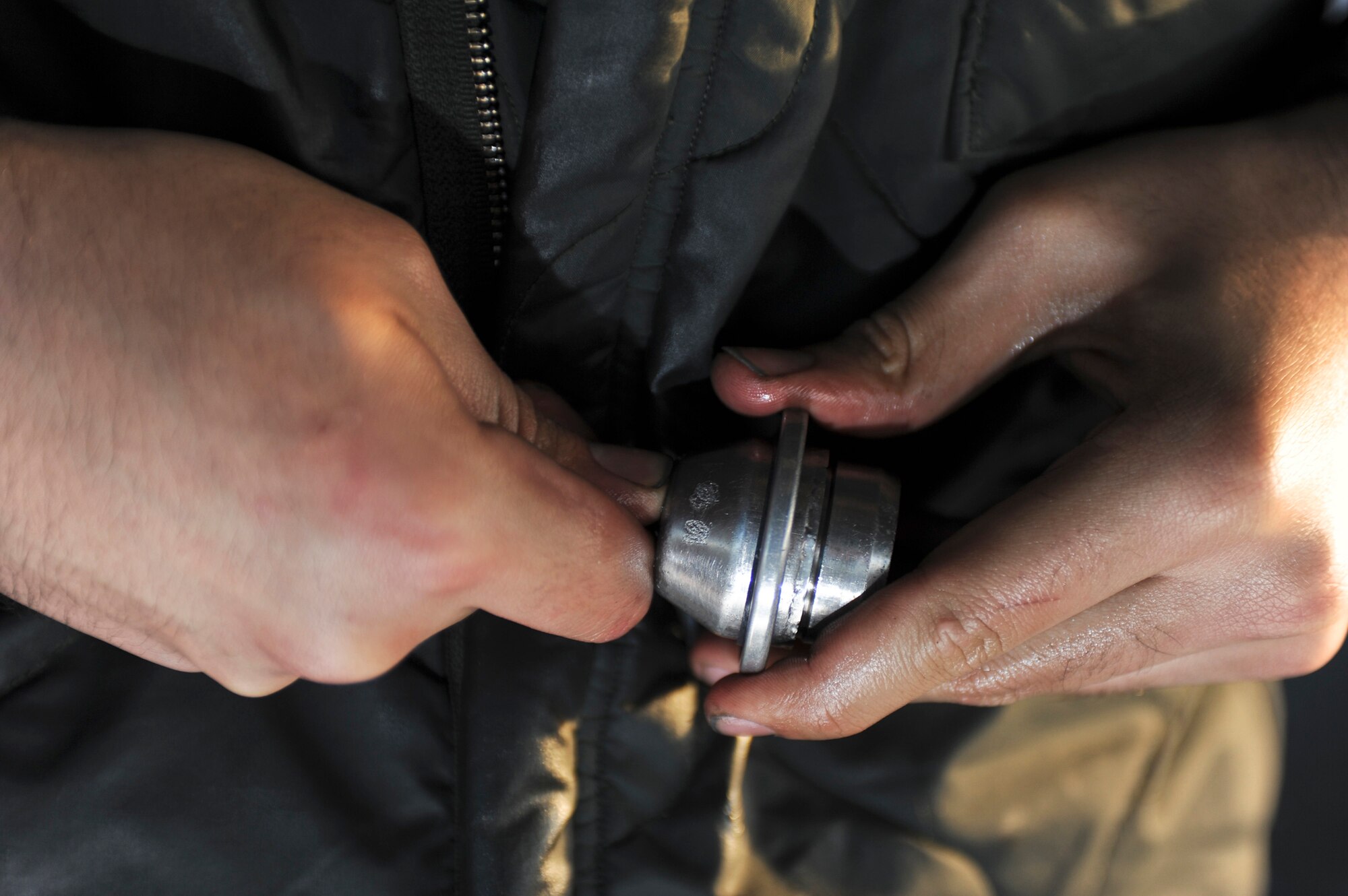ELMENDORF AIR FORCE BASE, Alaska – Senior Airman Matthew Orozco, 19th Aircraft Maintenance Unit crew chief, repairs a seal for an Elmendorf F-15 Eagle, Dec. 7. Orozco said that one of the biggest challenges of doing his job in the arctic environment is working with cold hands on freezing metal. (U.S. Air Force photo/Airman 1st Class Christopher Gross)