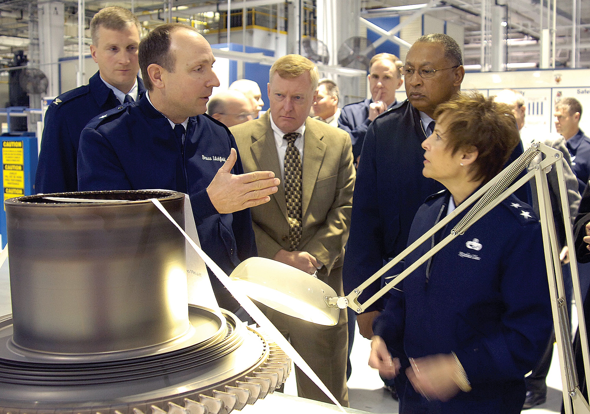 Brig. Gen. Bruce Litchfield, 76th Maintenance Wing commander, describes F101 engine repair issues with Maj. Gen. Kathleen Close, AFMC director of Logistics and Sustainment. Also listening, from far left are; Col. Evan Miller, Tinker’s 76th Propulsion Maintenance Group commander; James McGinley, AFMC Financial Management deputy director; and Maj. Gen. Gary McCoy, AFMC Air Force Global Logistics Support Center commander. Leaders from several areas across the Air Force gathered at Tinker Dec. 6-8 for the Repair Network Integration Update, working to find cost and time saving solutions as repair challenges evolve.  The F101 engine powers the B-1 bomber. (Air Force photo by Margo Wright)
